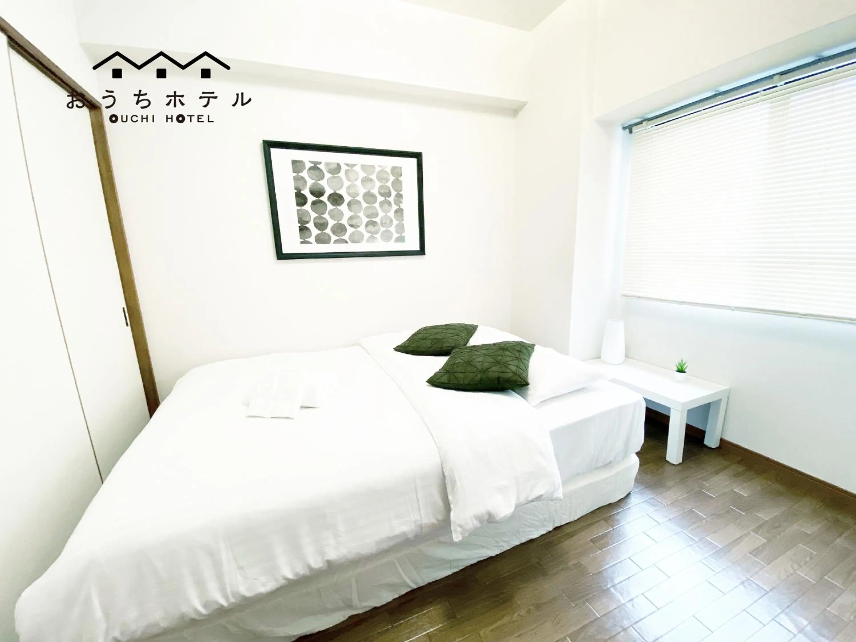 Bed in OUCHI HOTEL Dambara