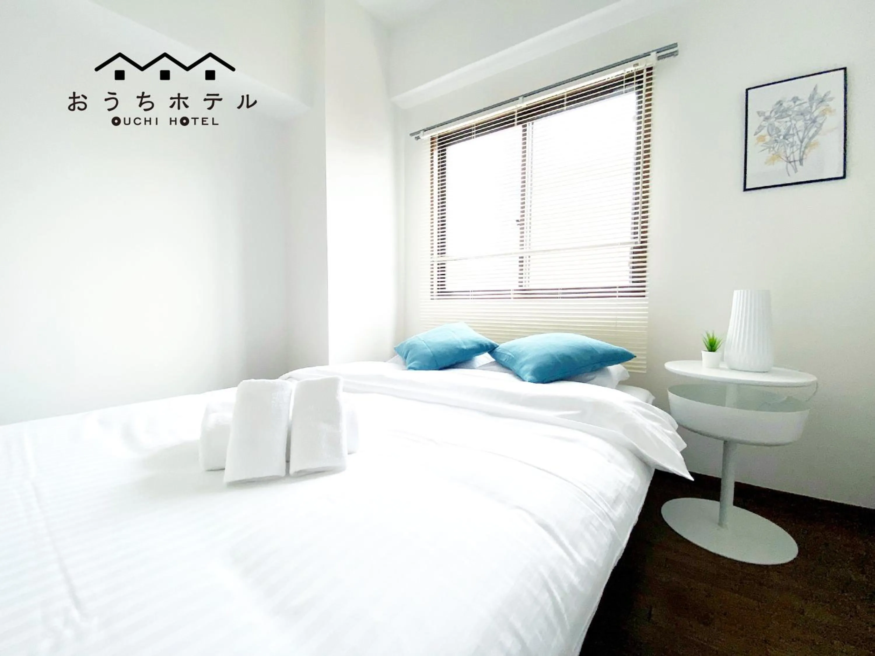 Bed in OUCHI HOTEL Dambara