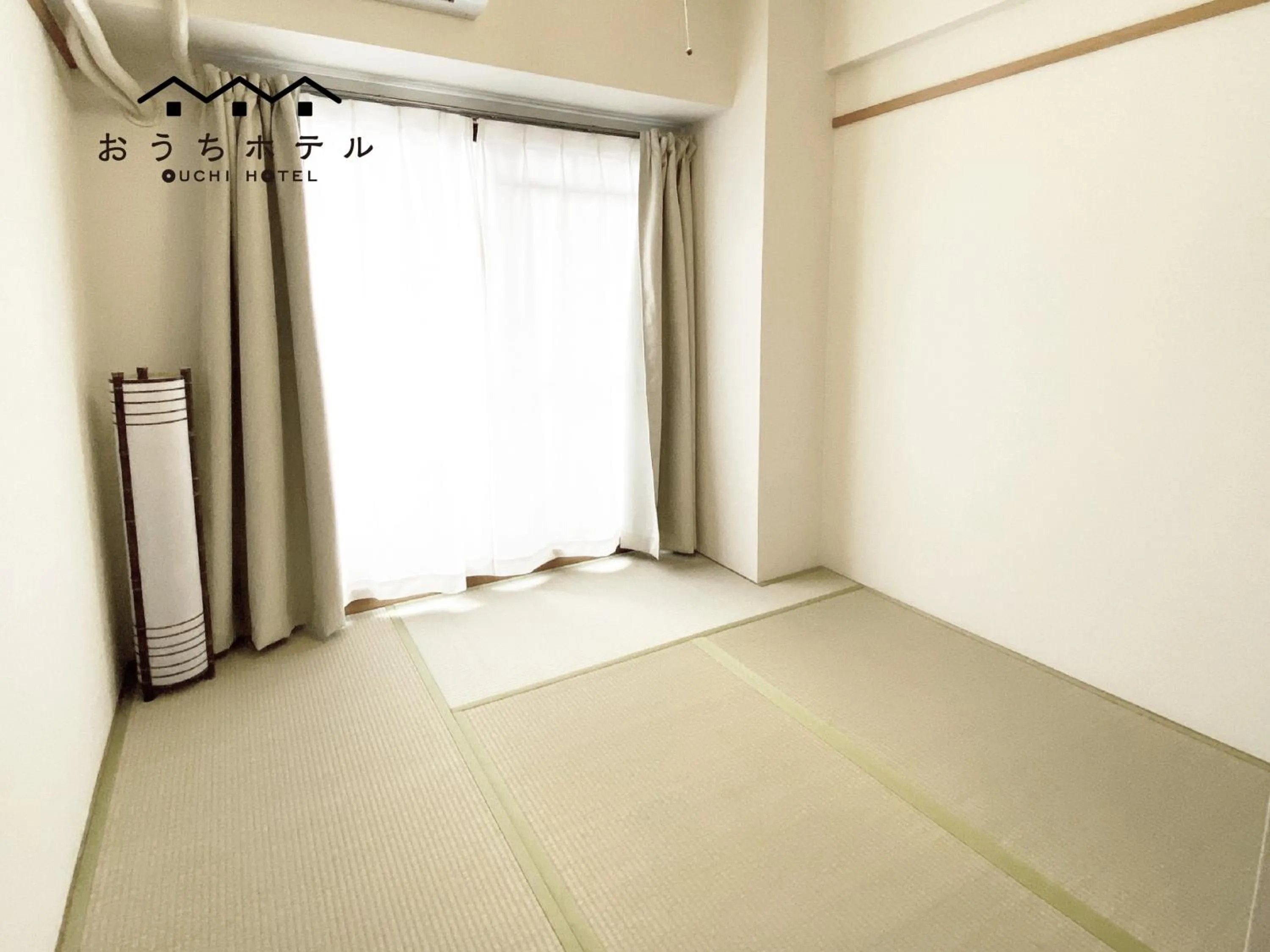 Bed in OUCHI HOTEL Dambara