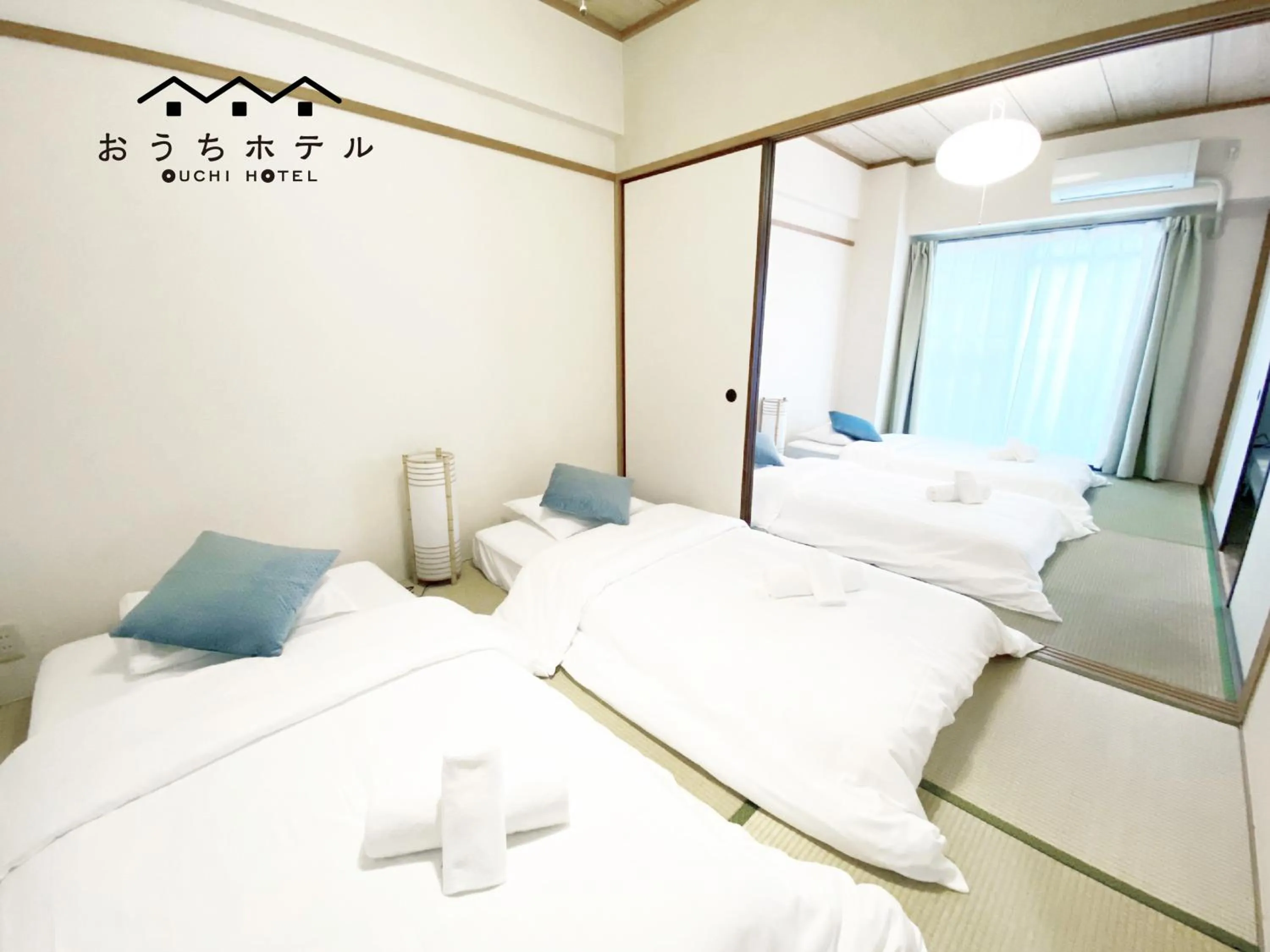 Bed in OUCHI HOTEL Dambara