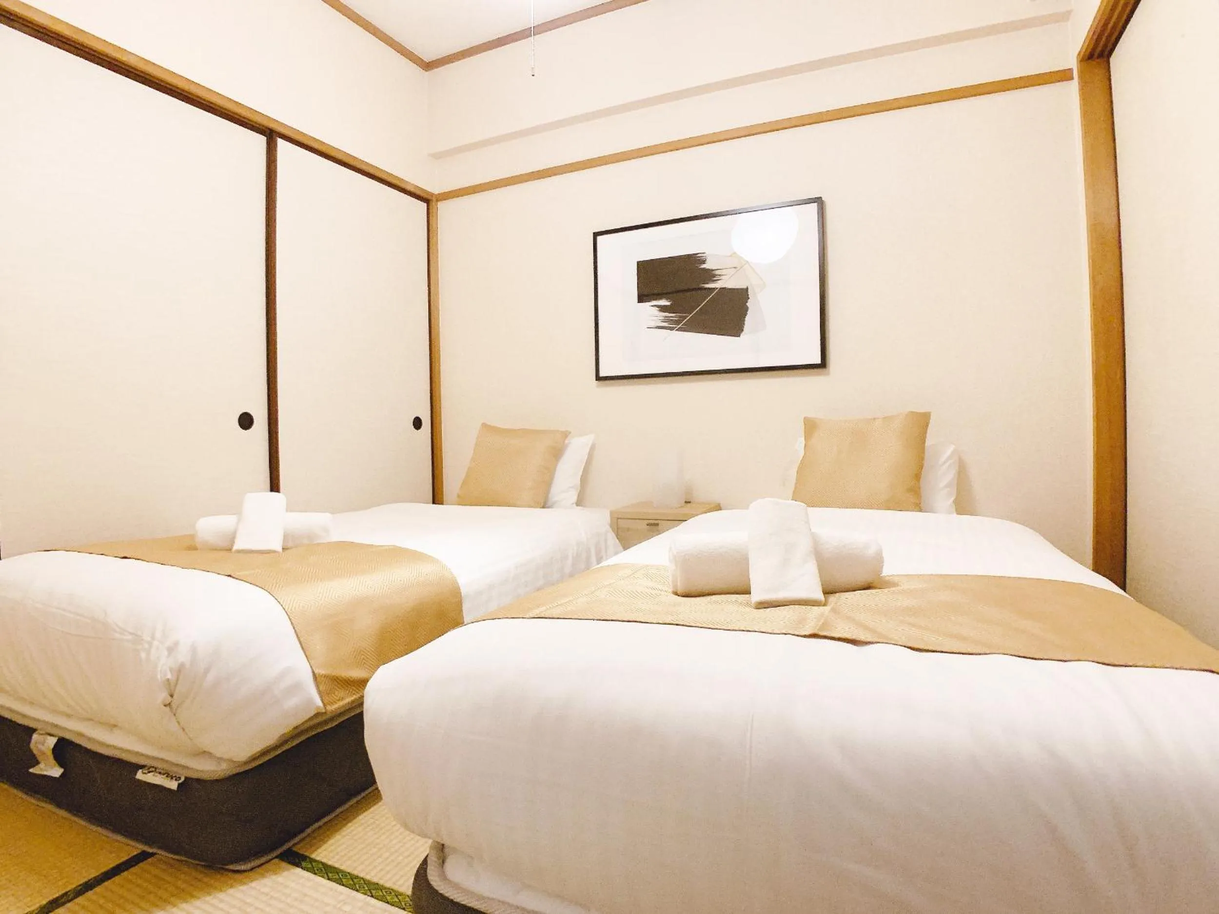 Bed in OUCHI HOTEL Dambara