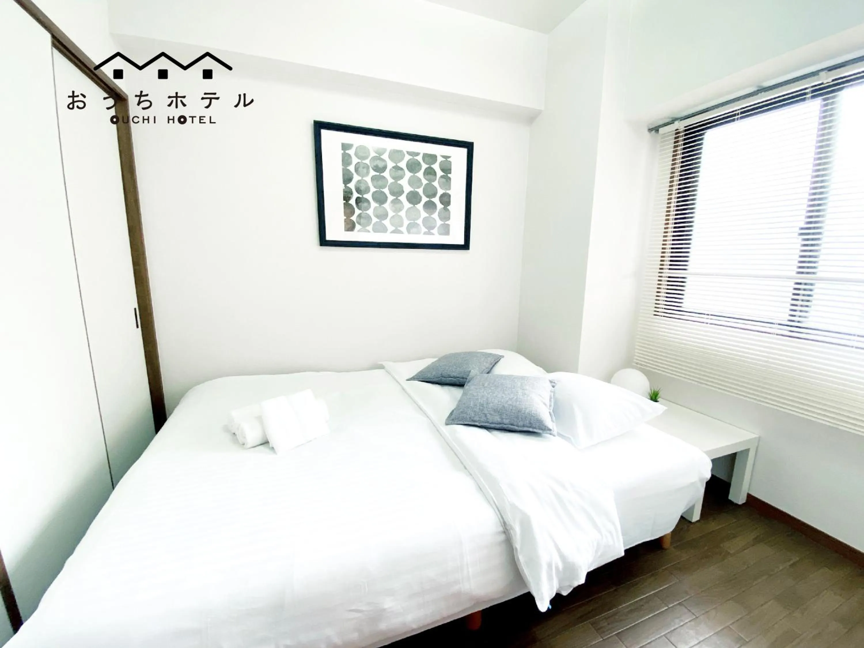 Bed in OUCHI HOTEL Dambara
