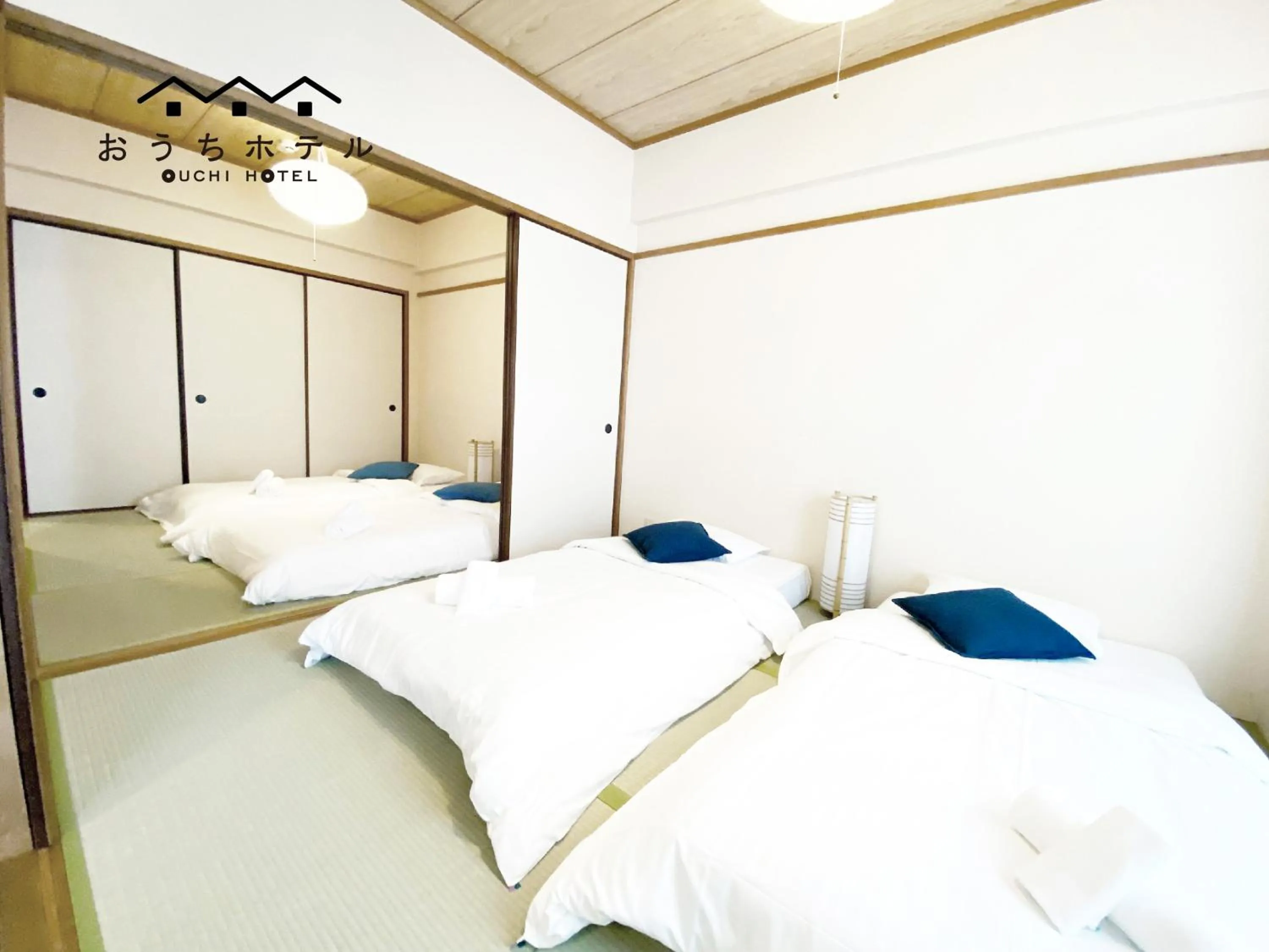 Bed in OUCHI HOTEL Dambara