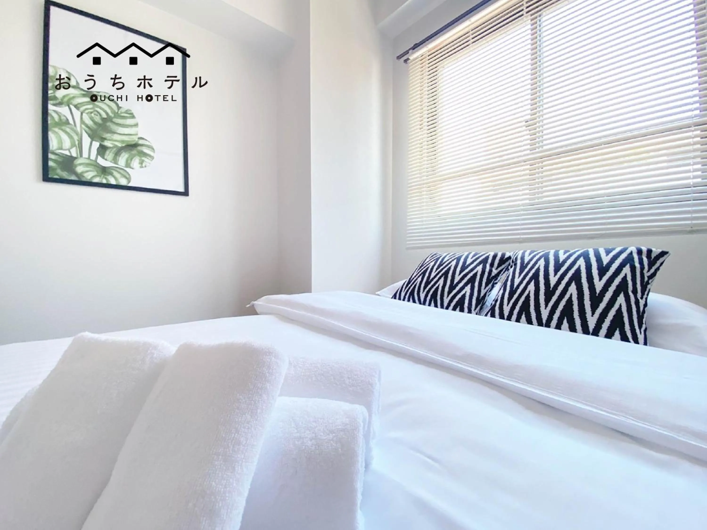 Bed in OUCHI HOTEL Dambara