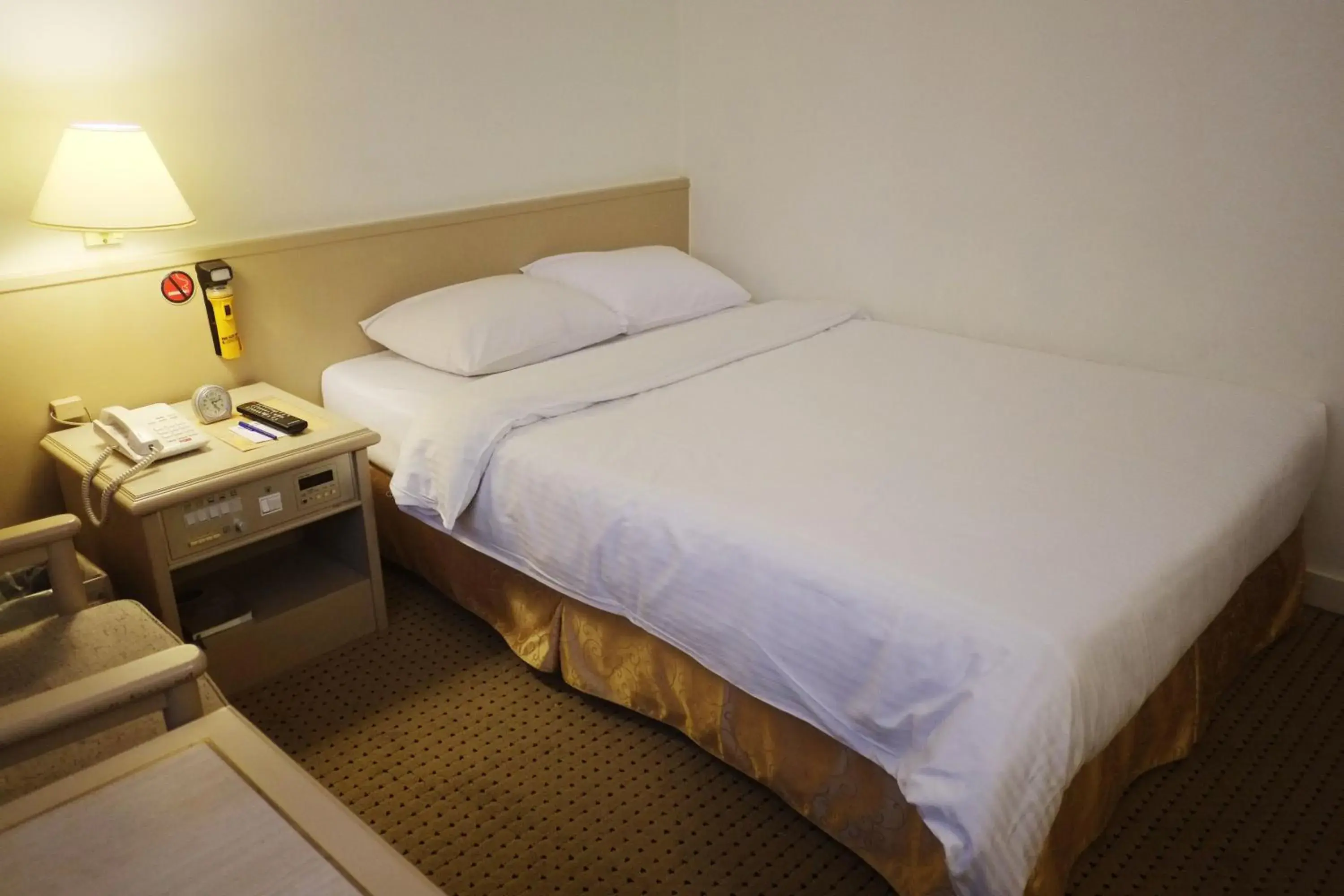 Bed in Emperor Hotel Bed in Emperor Hotel