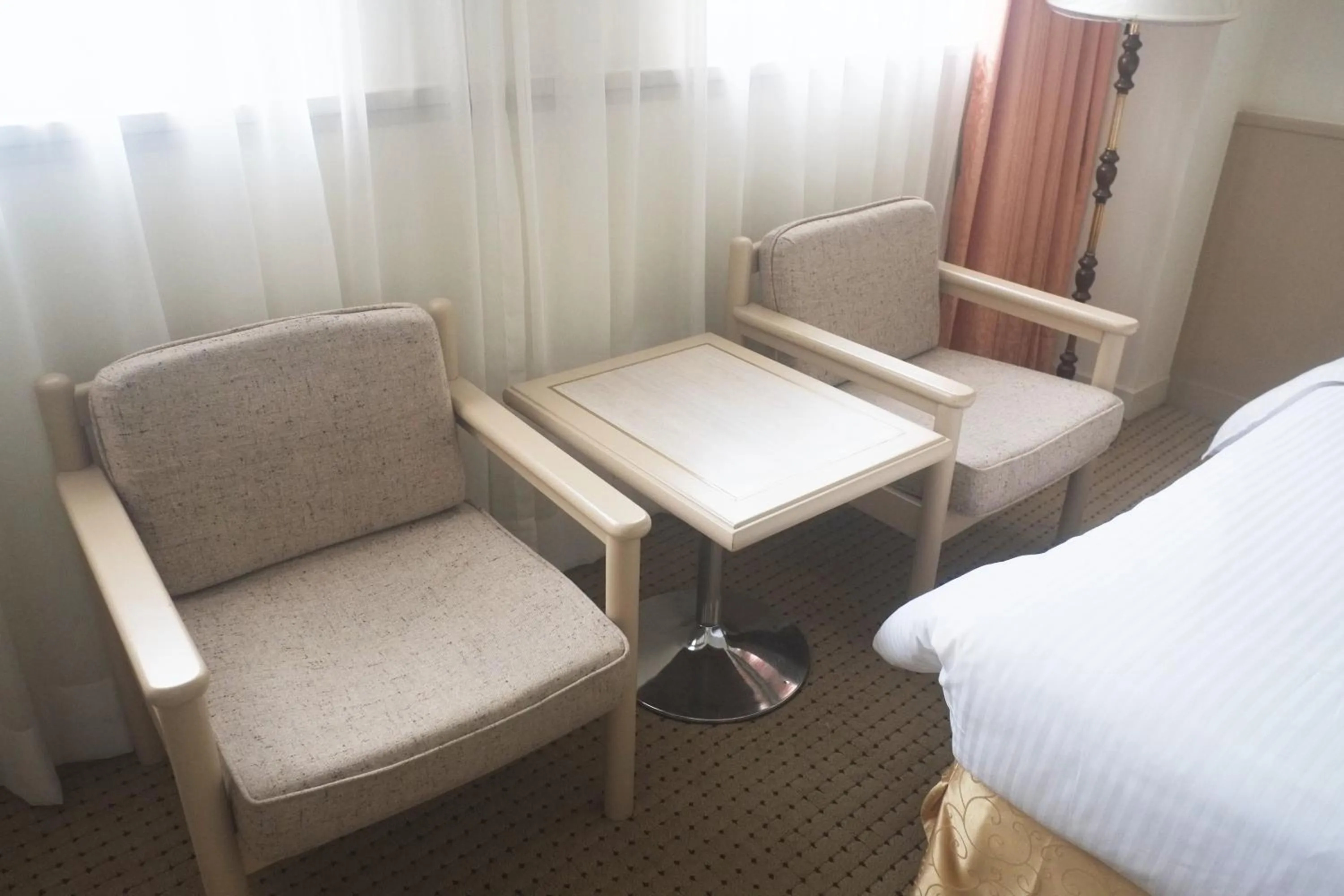 Seating area, Bed in Emperor Hotel