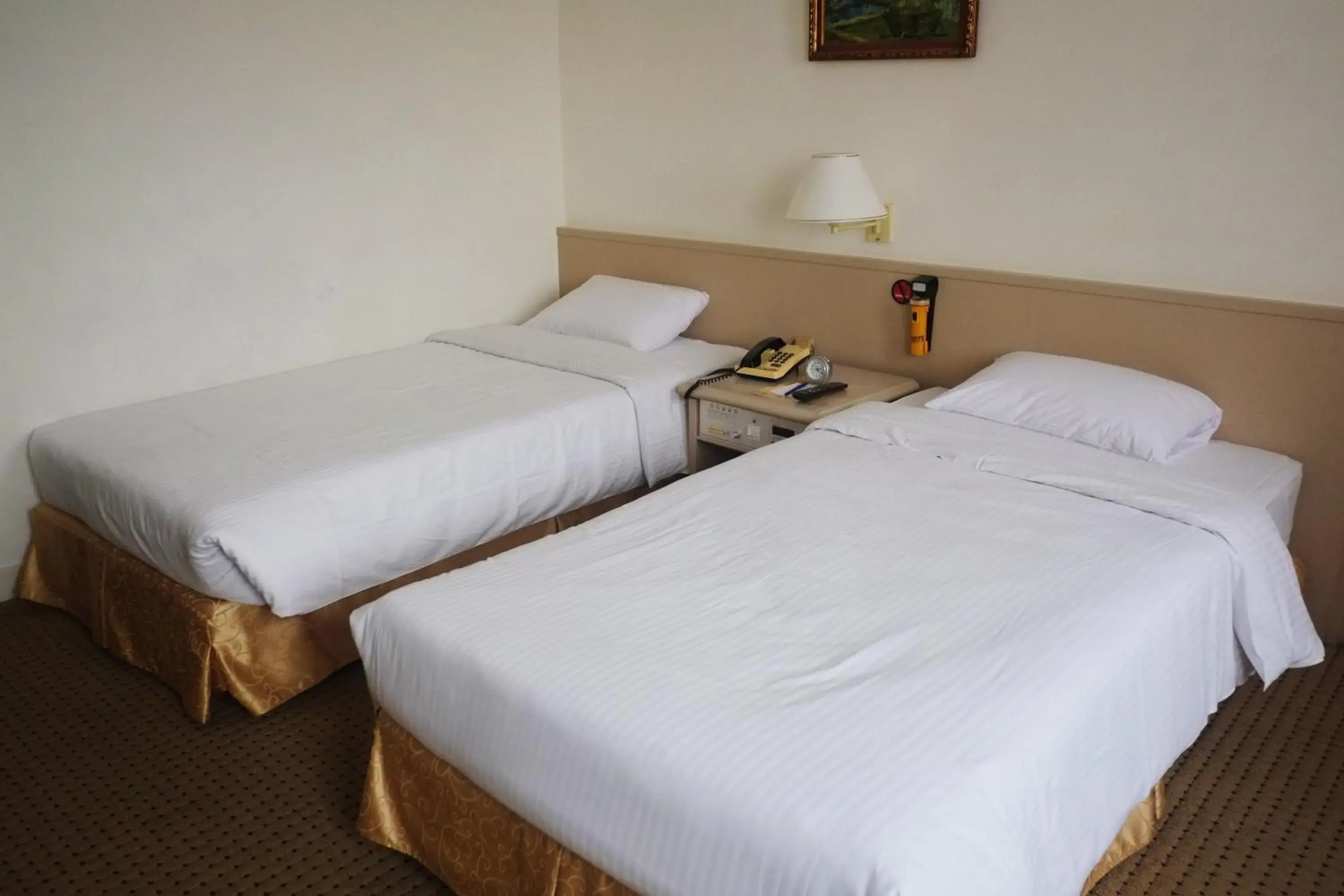 Bed in Emperor Hotel Bed in Emperor Hotel