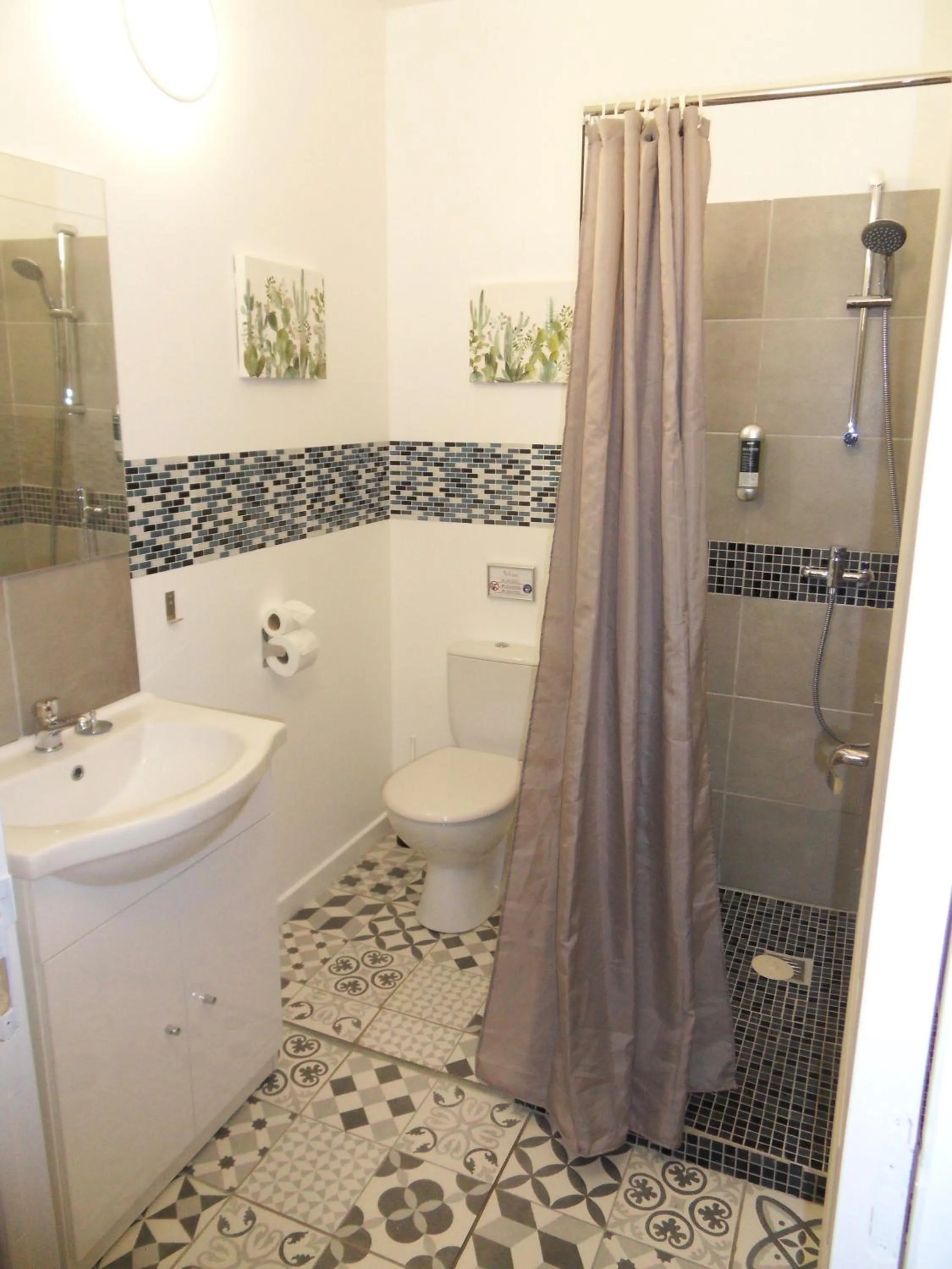 Bathroom in Logis Hôtel Restaurant Les Aubuns