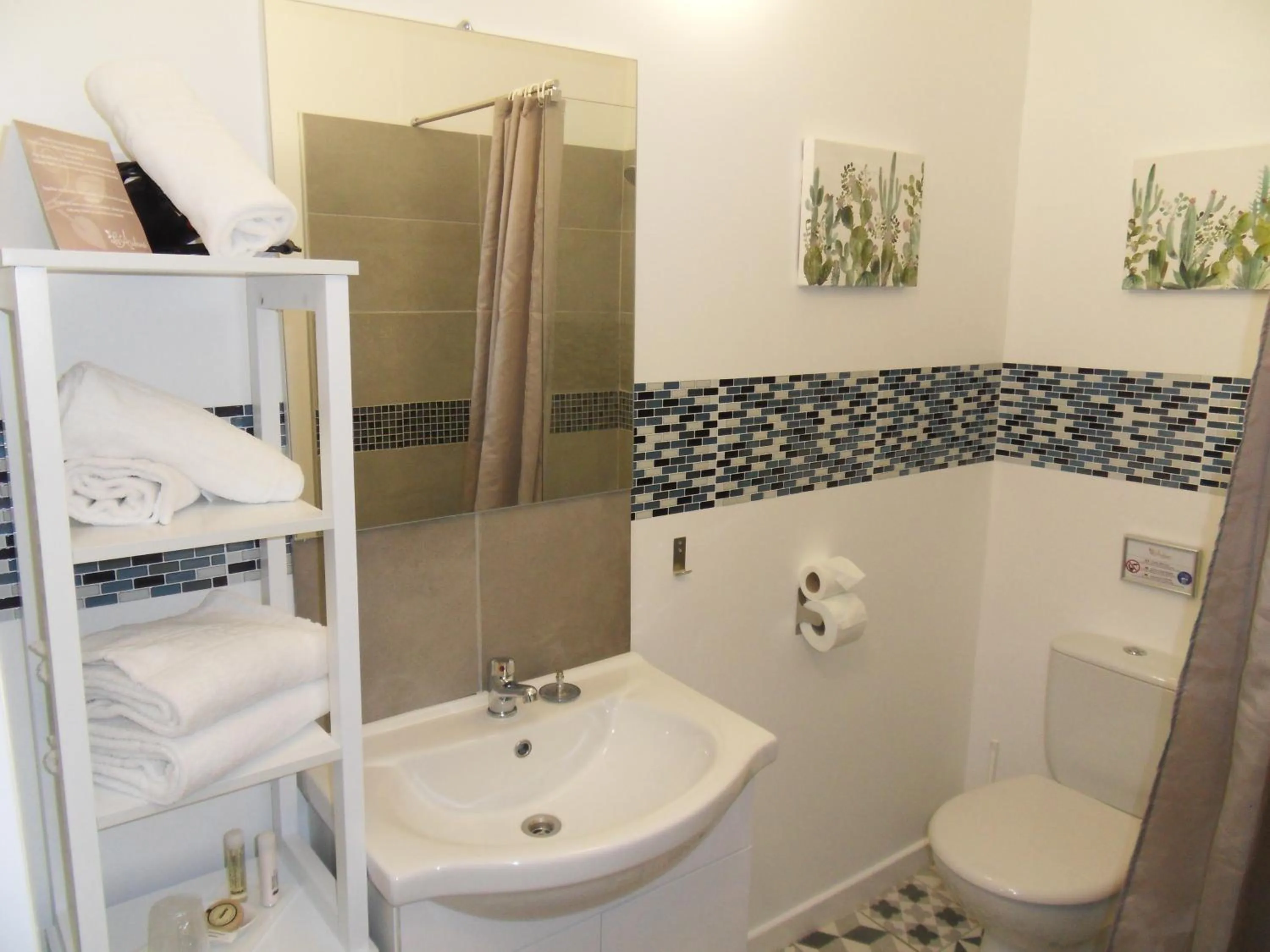 Bathroom in Logis Hôtel Restaurant Les Aubuns