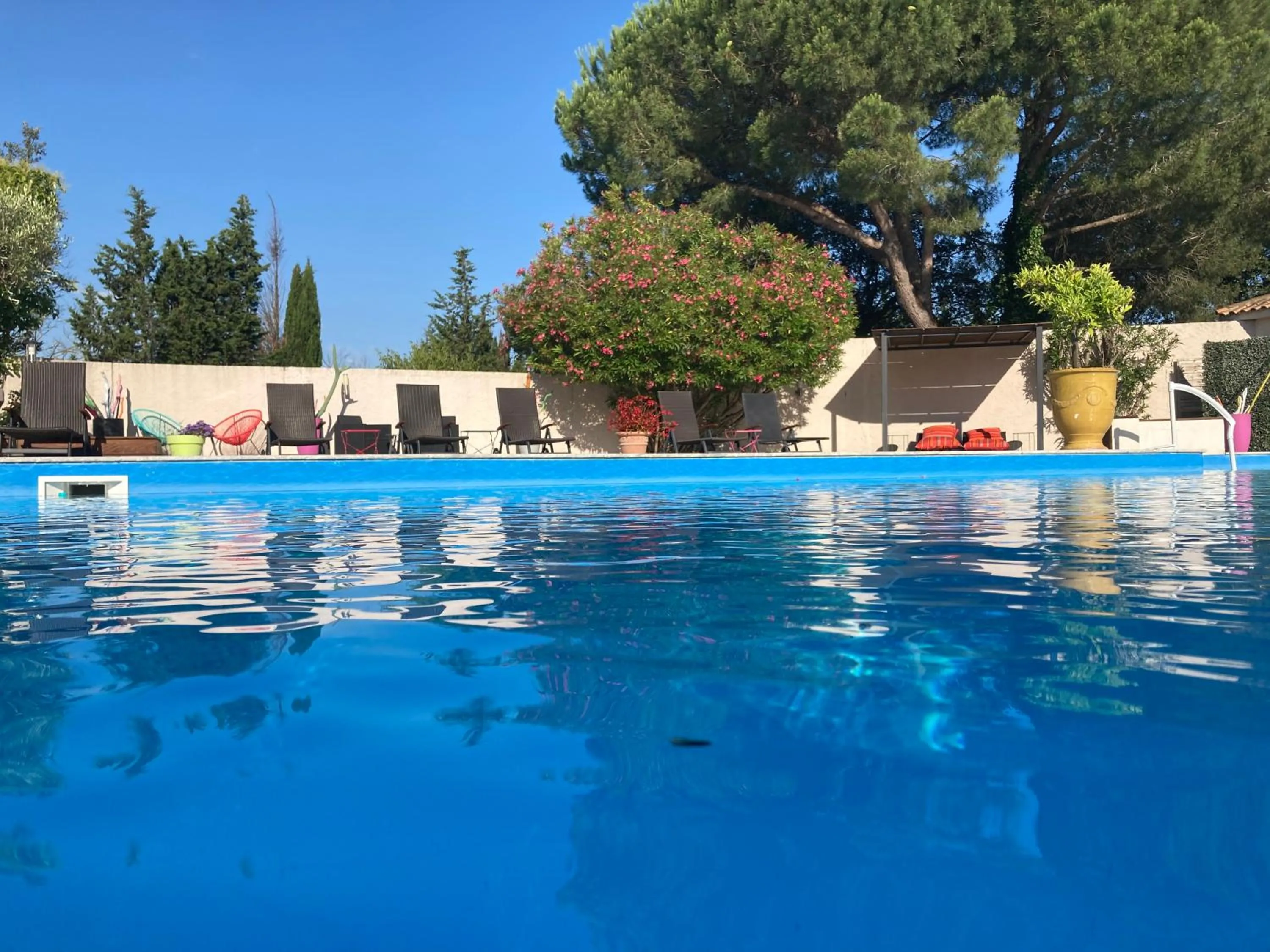 Swimming pool in Logis Hôtel Restaurant Les Aubuns