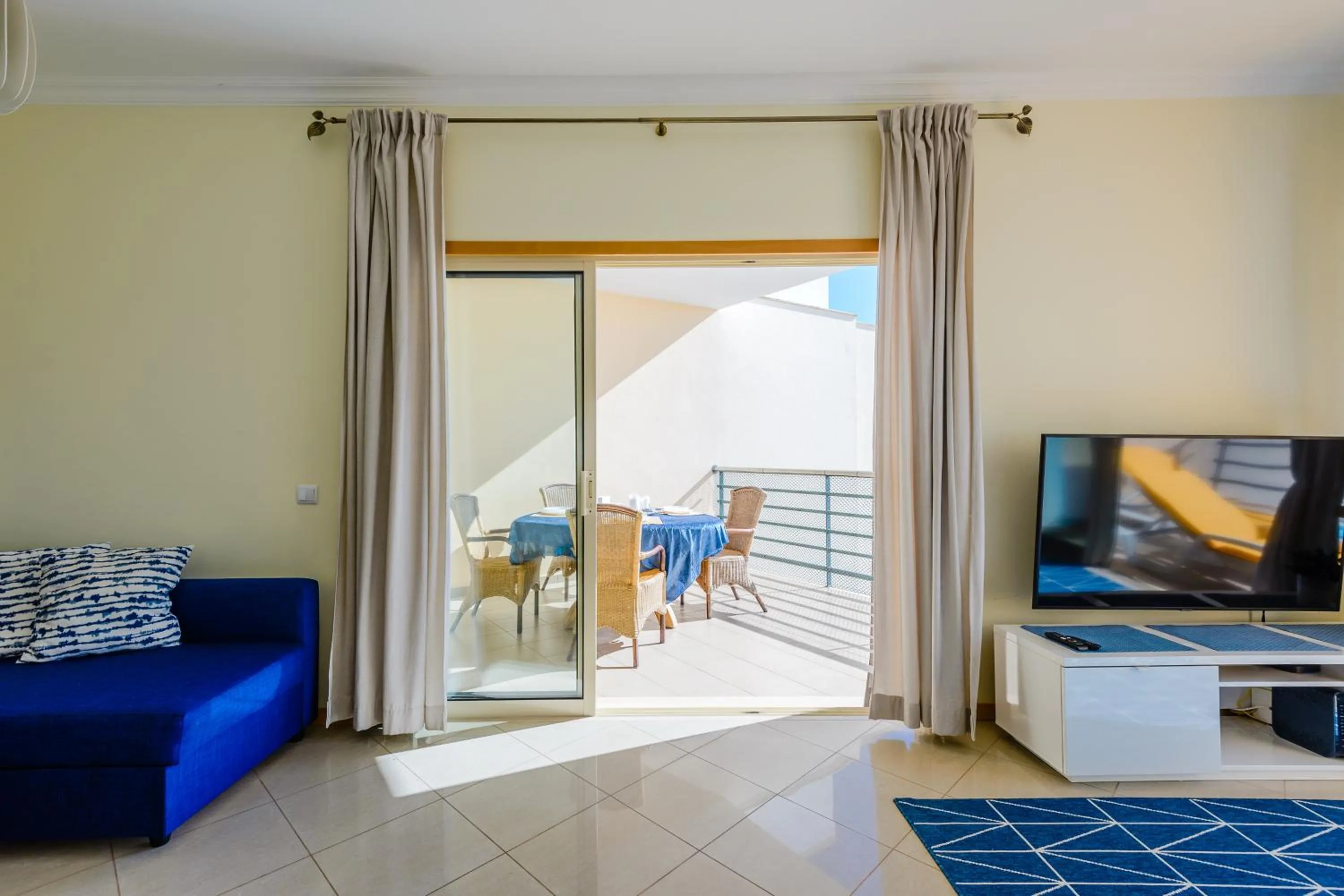 Communal lounge/ TV room in BnB Homes Ocean view Apartment with 3 spacious Terraces, 2 Swimming pools & Tennis court