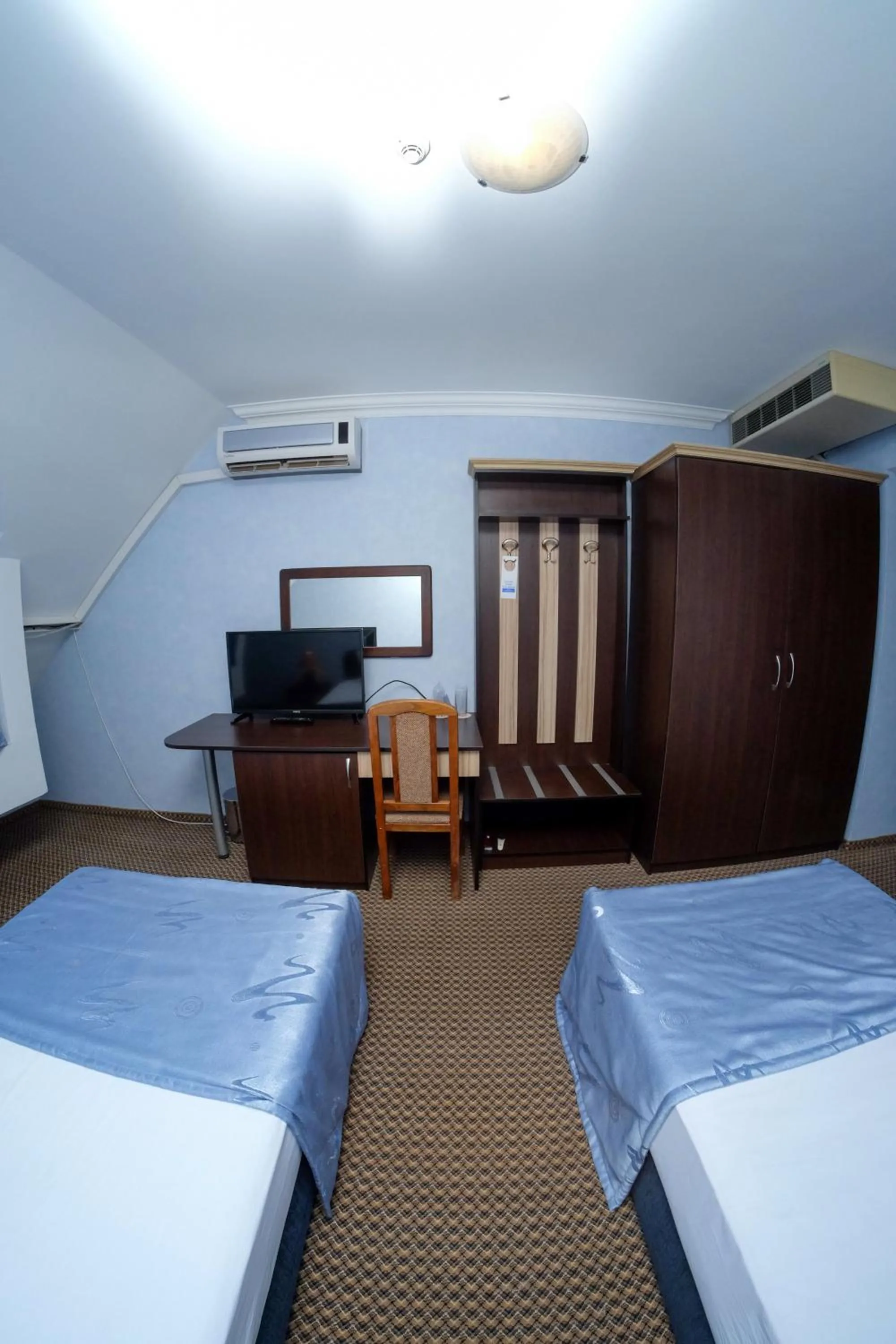 Communal lounge/ TV room, Bed in Haskovo Hotel