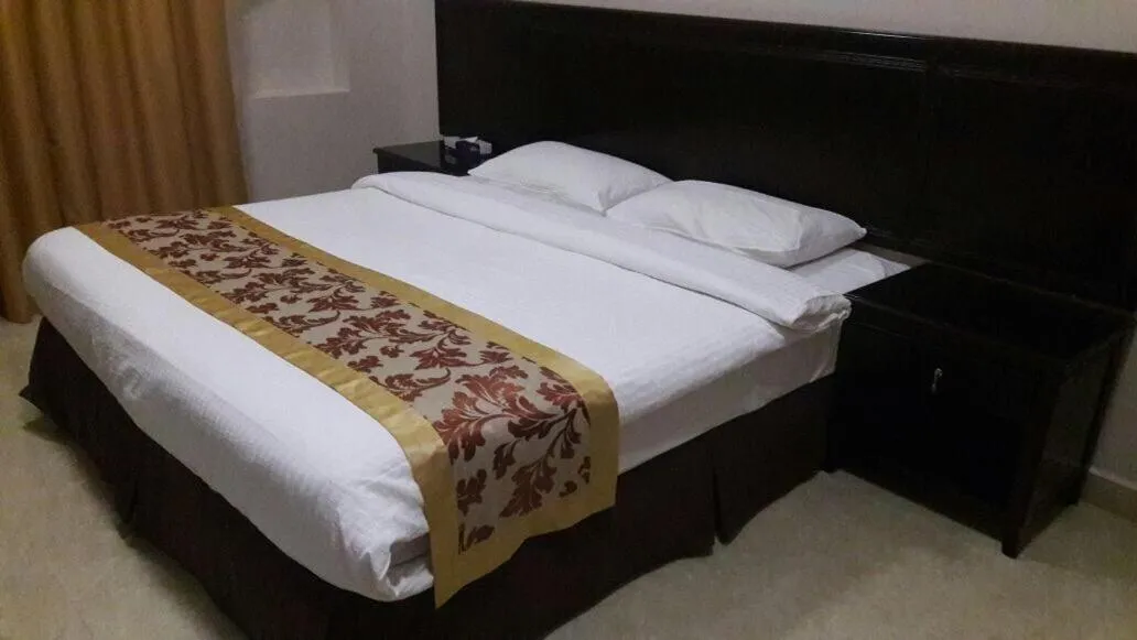 Bed in Gulf Crown Hotel Apartment