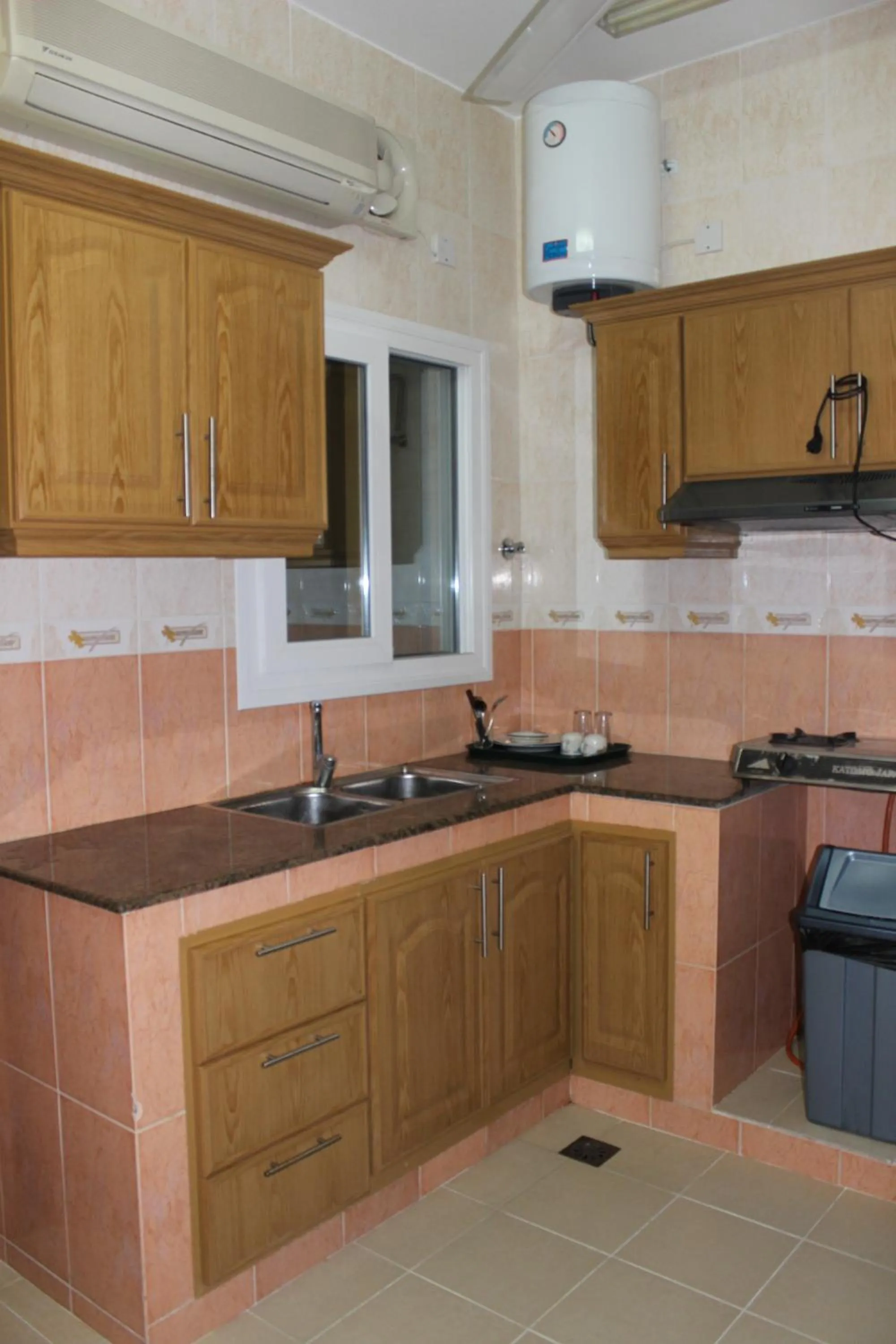 Kitchen or kitchenette in Gulf Crown Hotel Apartment