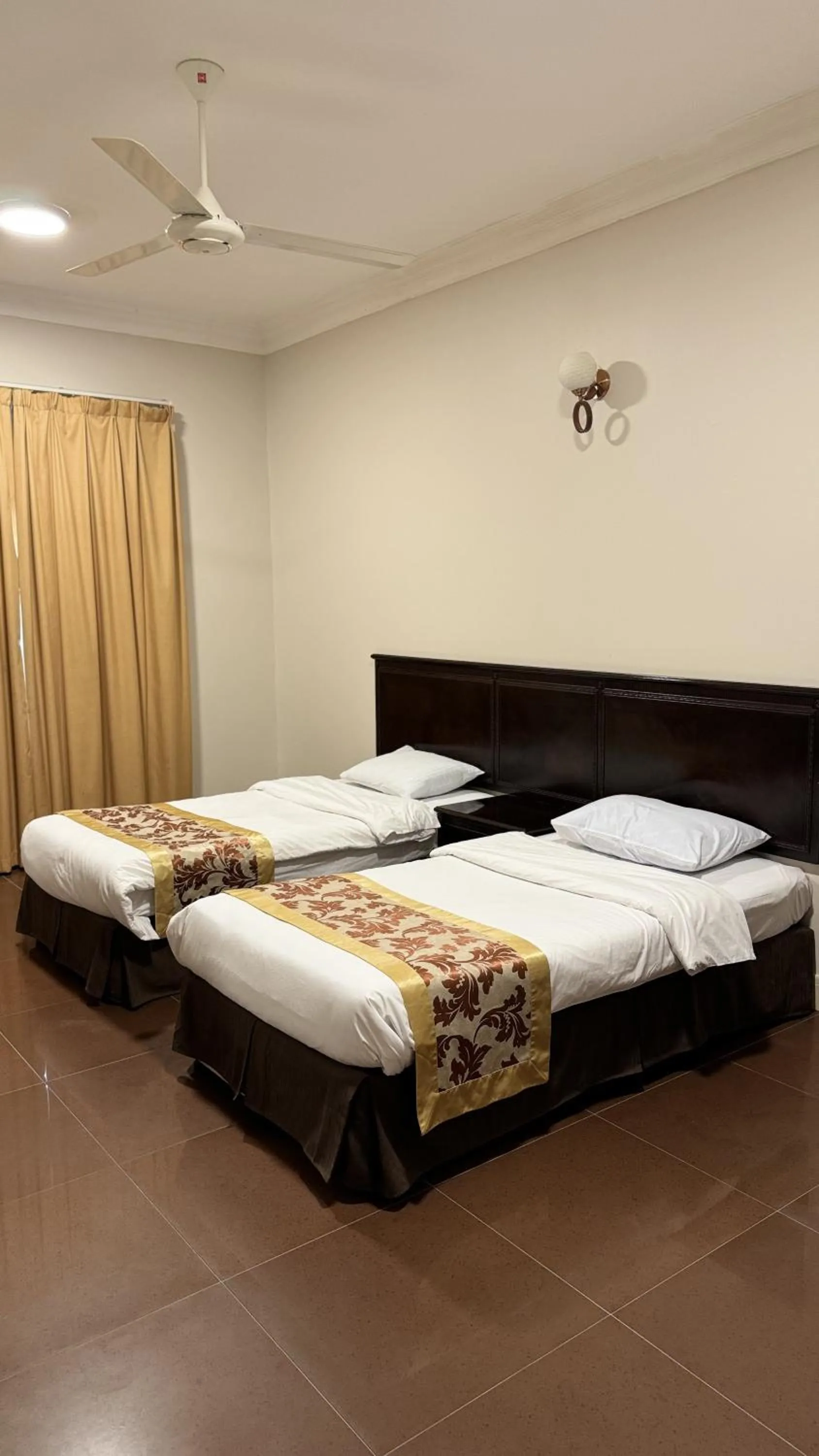 Bed in Gulf Crown Hotel Apartment