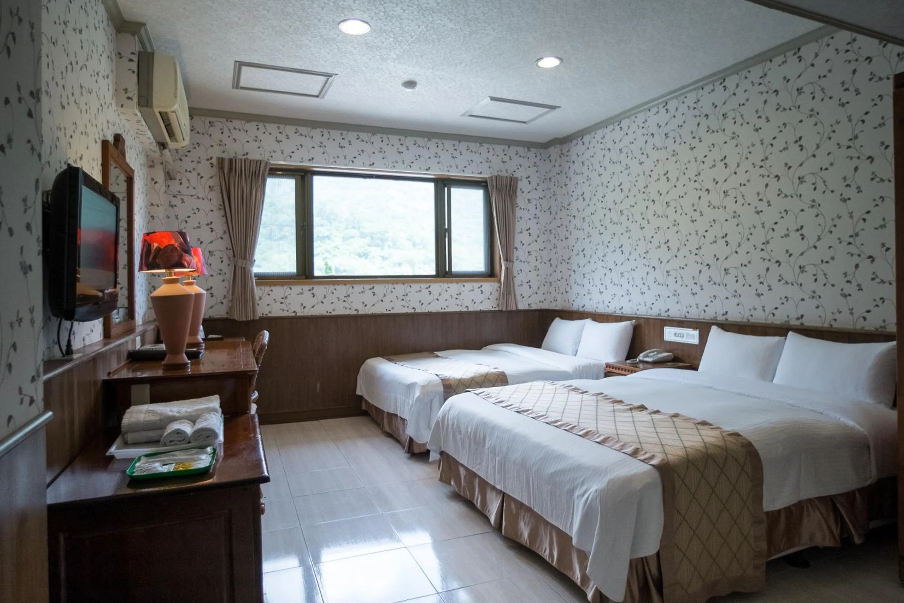 Bed in Rainbow Resort Hotel