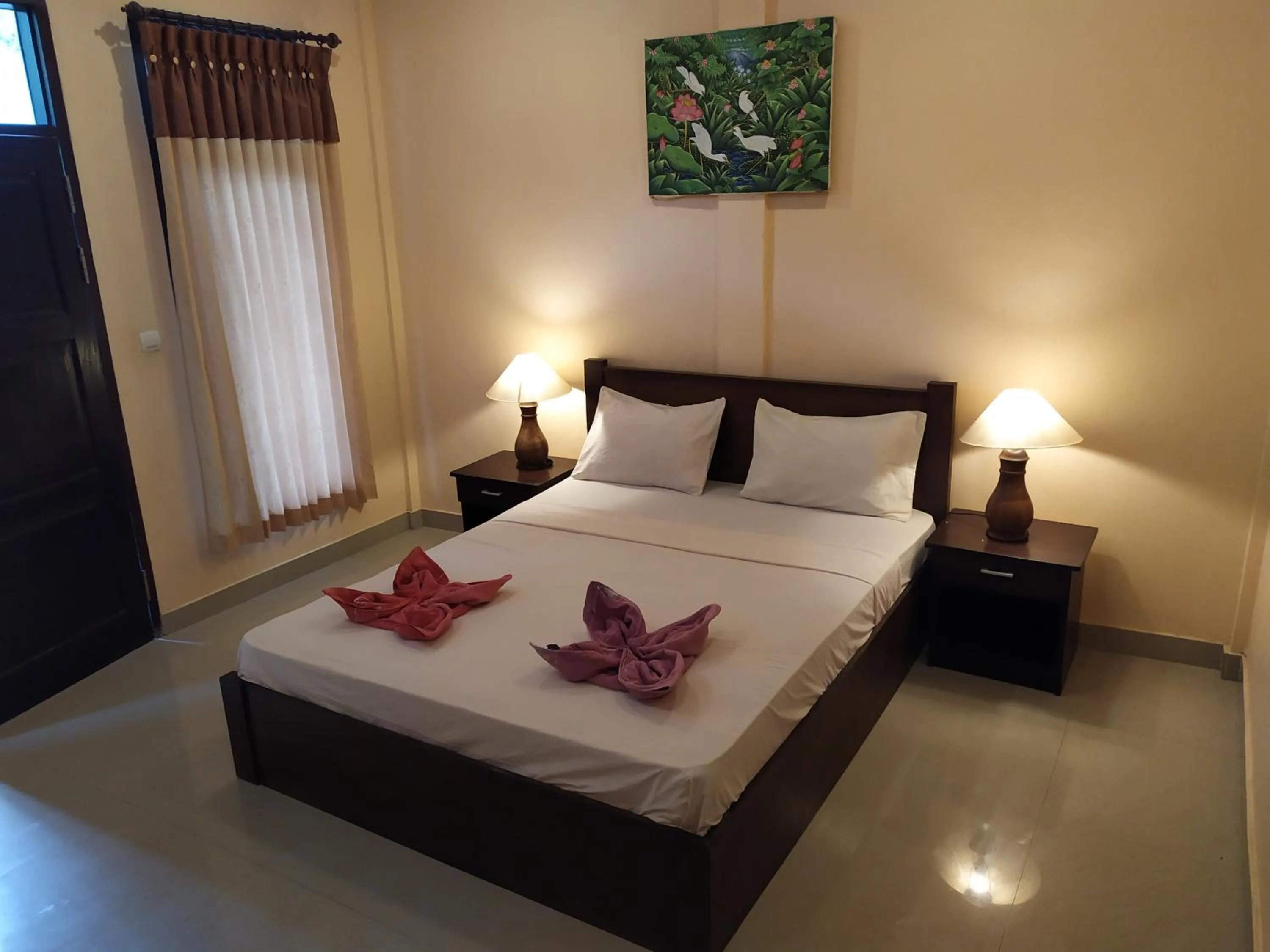 Bed in Kusuka Bungalow