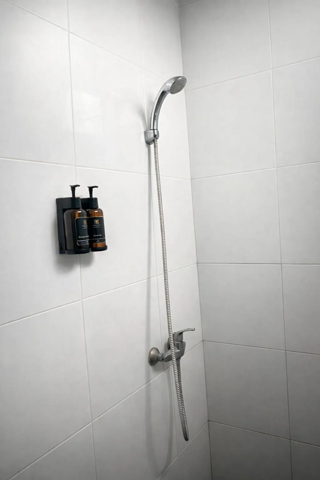 Shower in Grand Kuta Hotel Lombok - Pool - 43 inch Google TV - Strong 60Mbps WiFi - New Enhanced Management