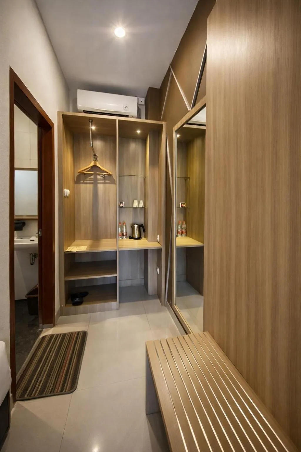 wardrobe in Grand Kuta Hotel Lombok - Pool - 43 inch Google TV - Strong 60Mbps WiFi - New Enhanced Management