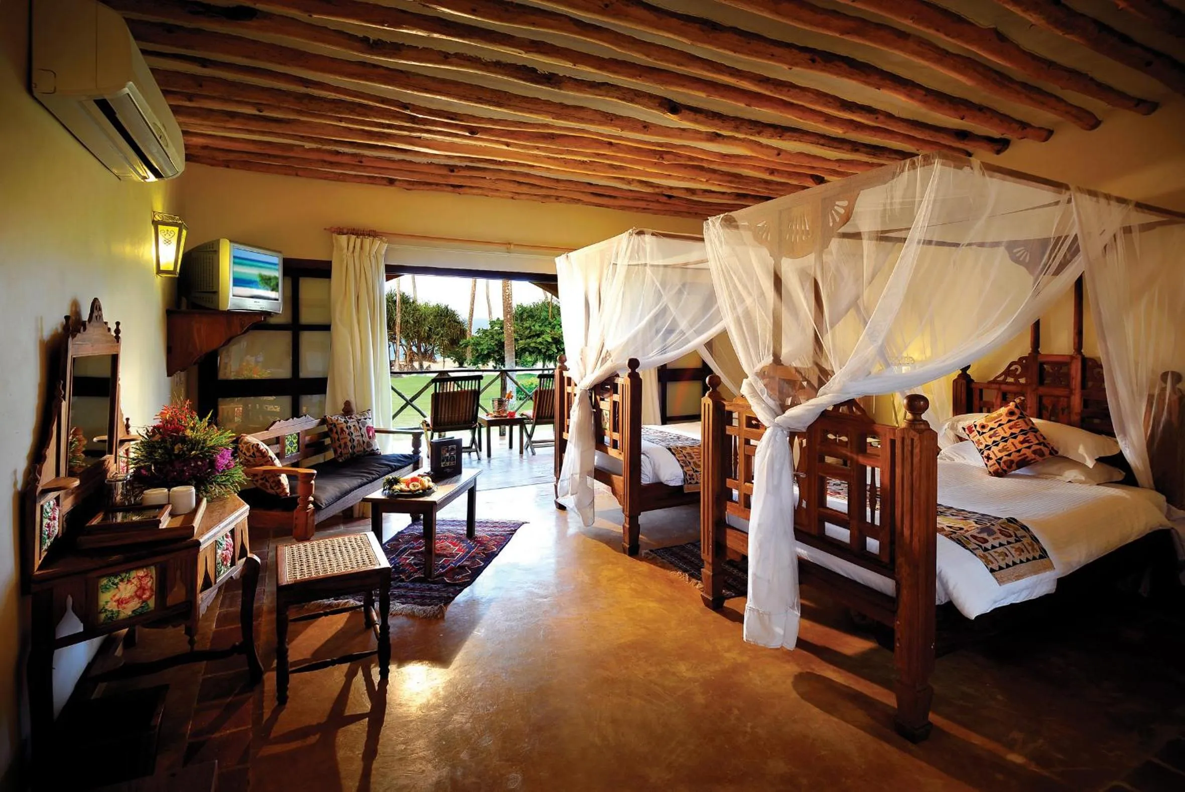 Photo of the whole room, Bed in Neptune Pwani Beach Resort & Spa Zanzibar - All Inclusive