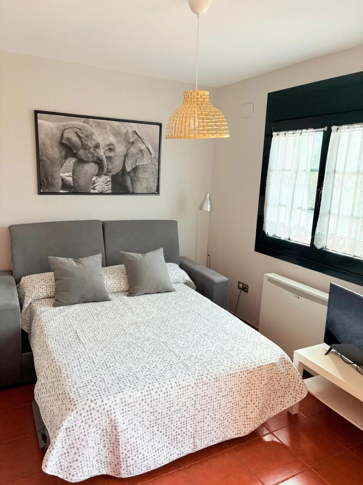 Living room, Bed in Apartamentos Luarca