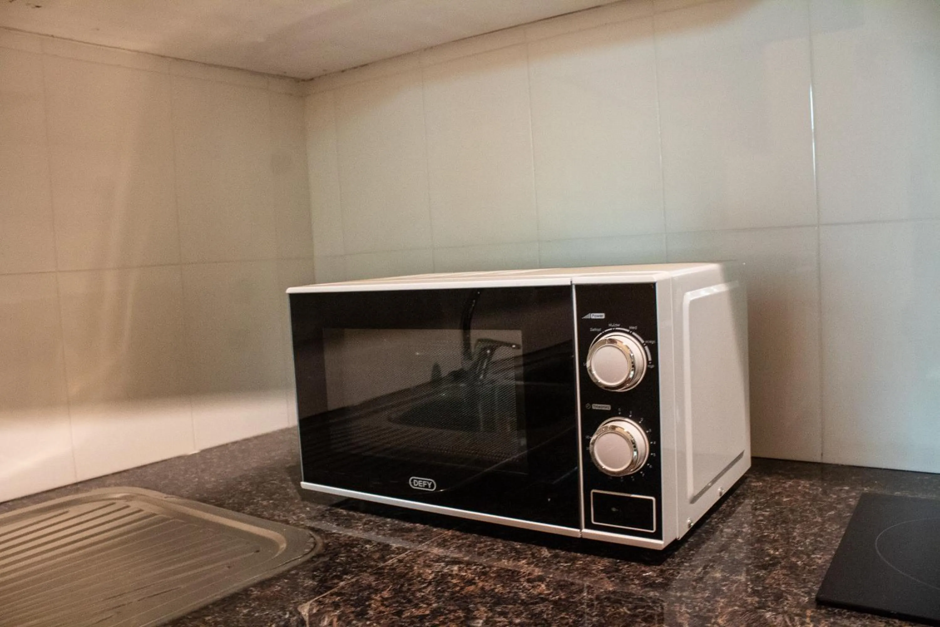 Kitchen or kitchenette in MalVille Boutique Hotel