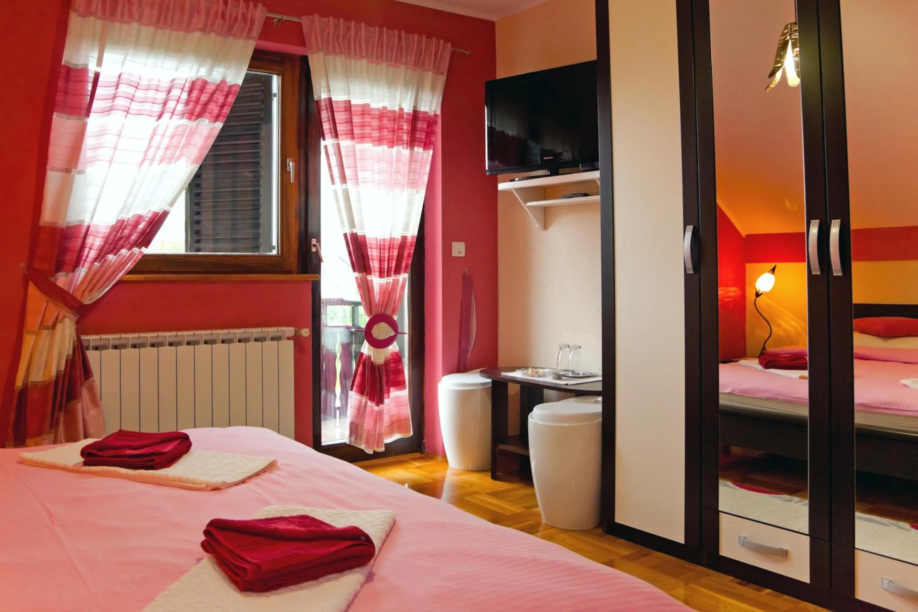 Double Room with Balcony in Apartments Tratinčica