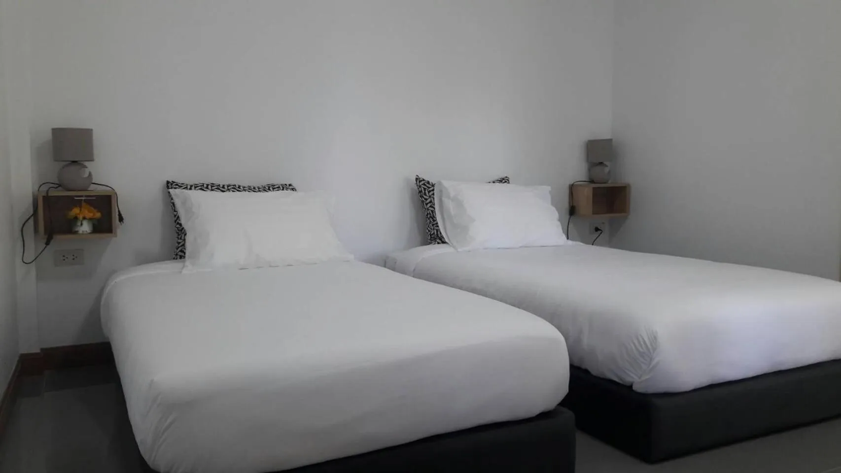 Bed in CoZyHouseChiangrai