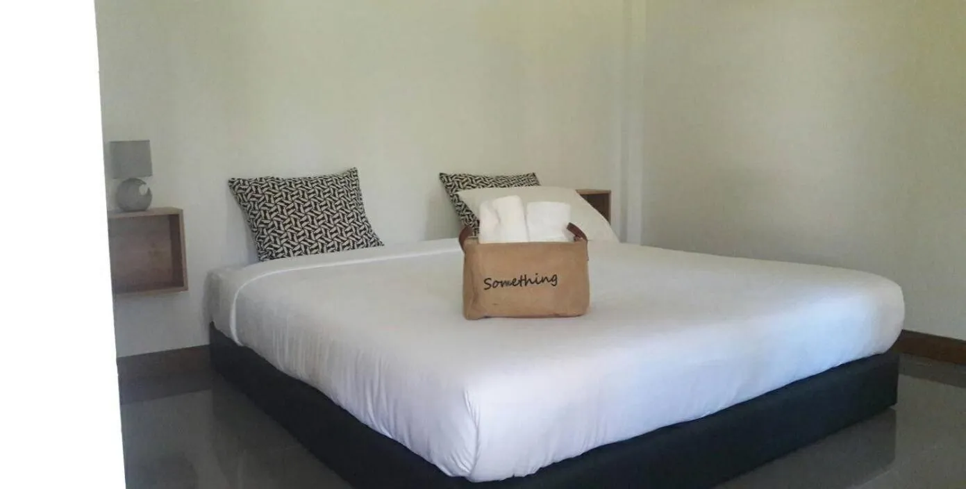 Bed in CoZyHouseChiangrai