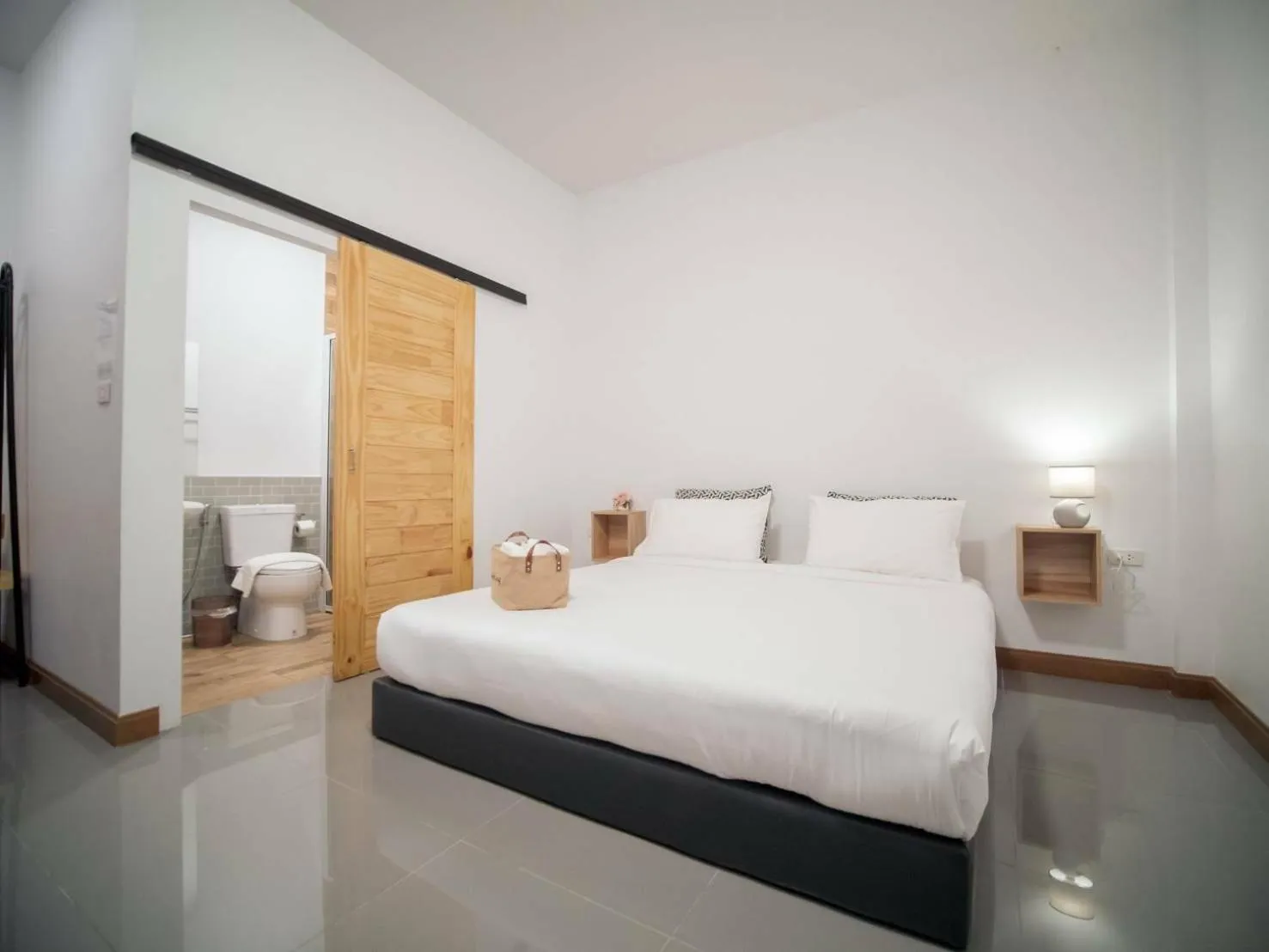 Bed in CoZyHouseChiangrai