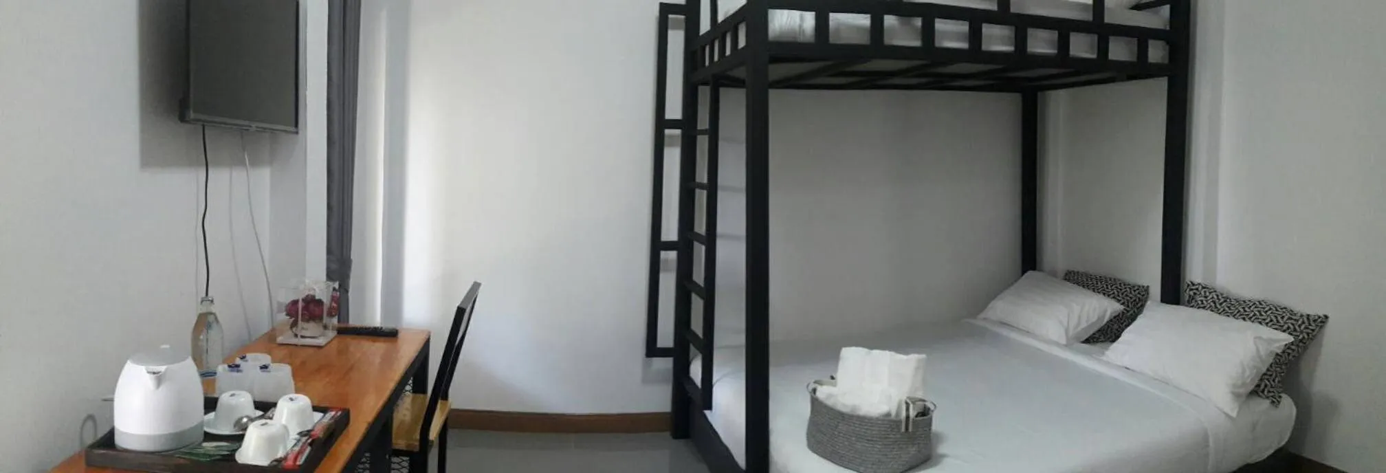 Bed in CoZyHouseChiangrai
