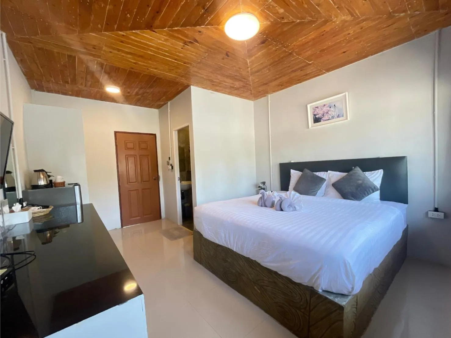 Bed in MOOK BOONCHU HOTEL