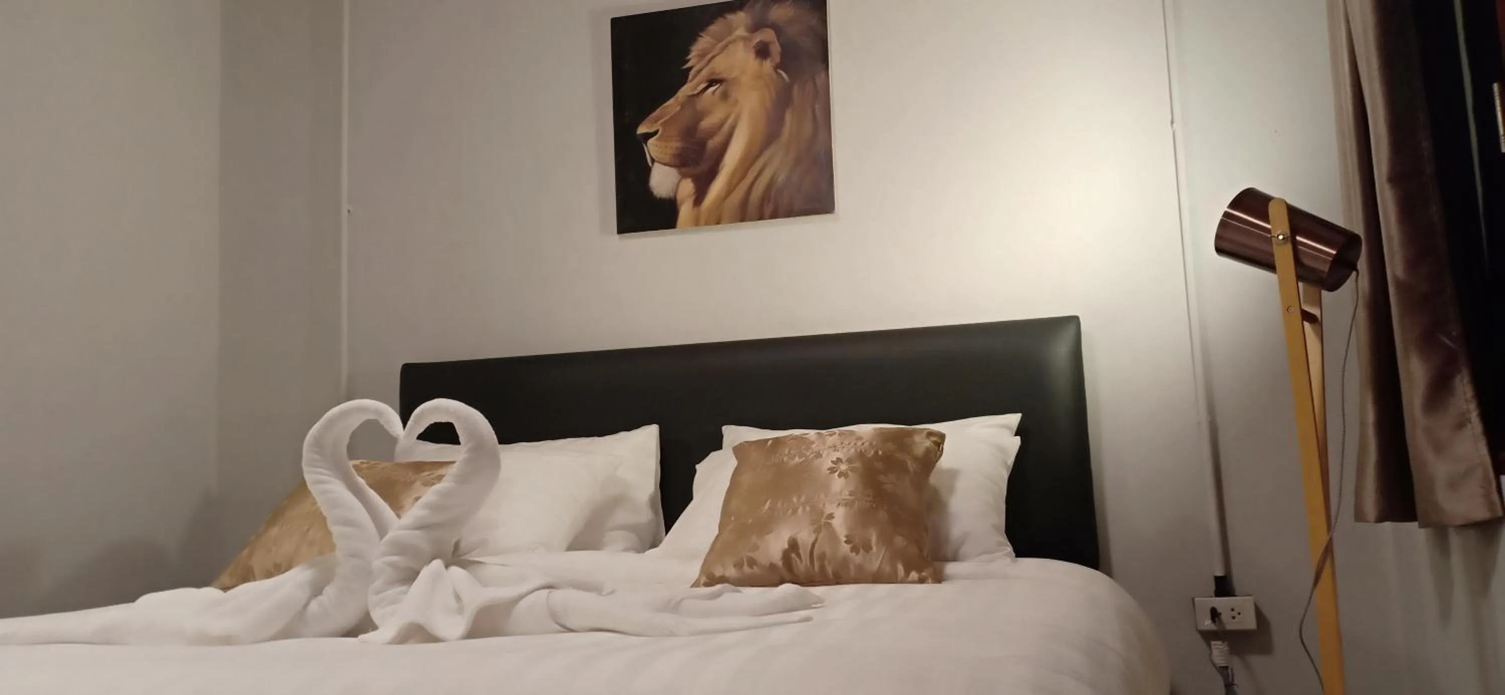 Bed in MOOK BOONCHU HOTEL