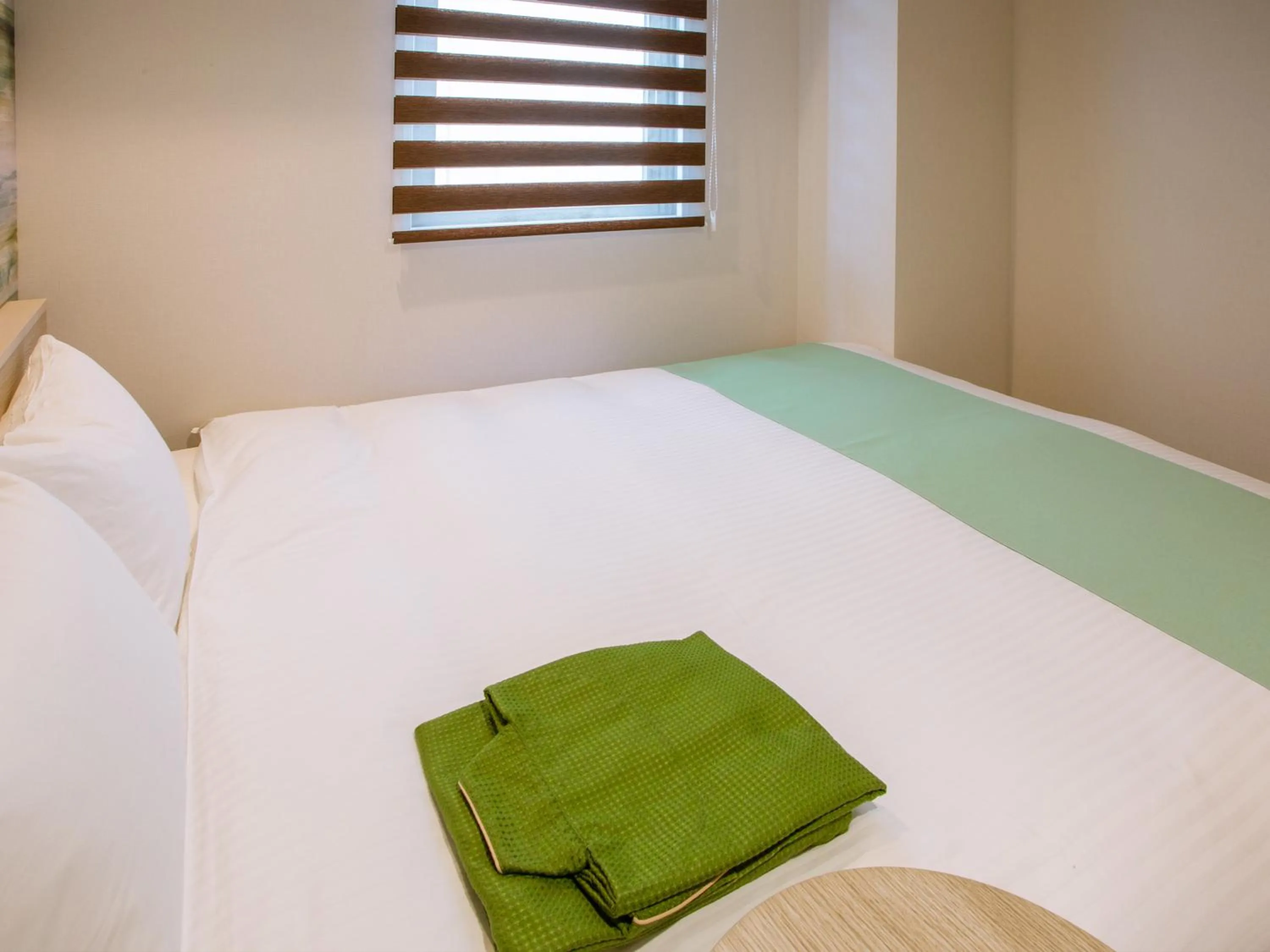 Bed in Kuretake Inn Ogaki Ekimae