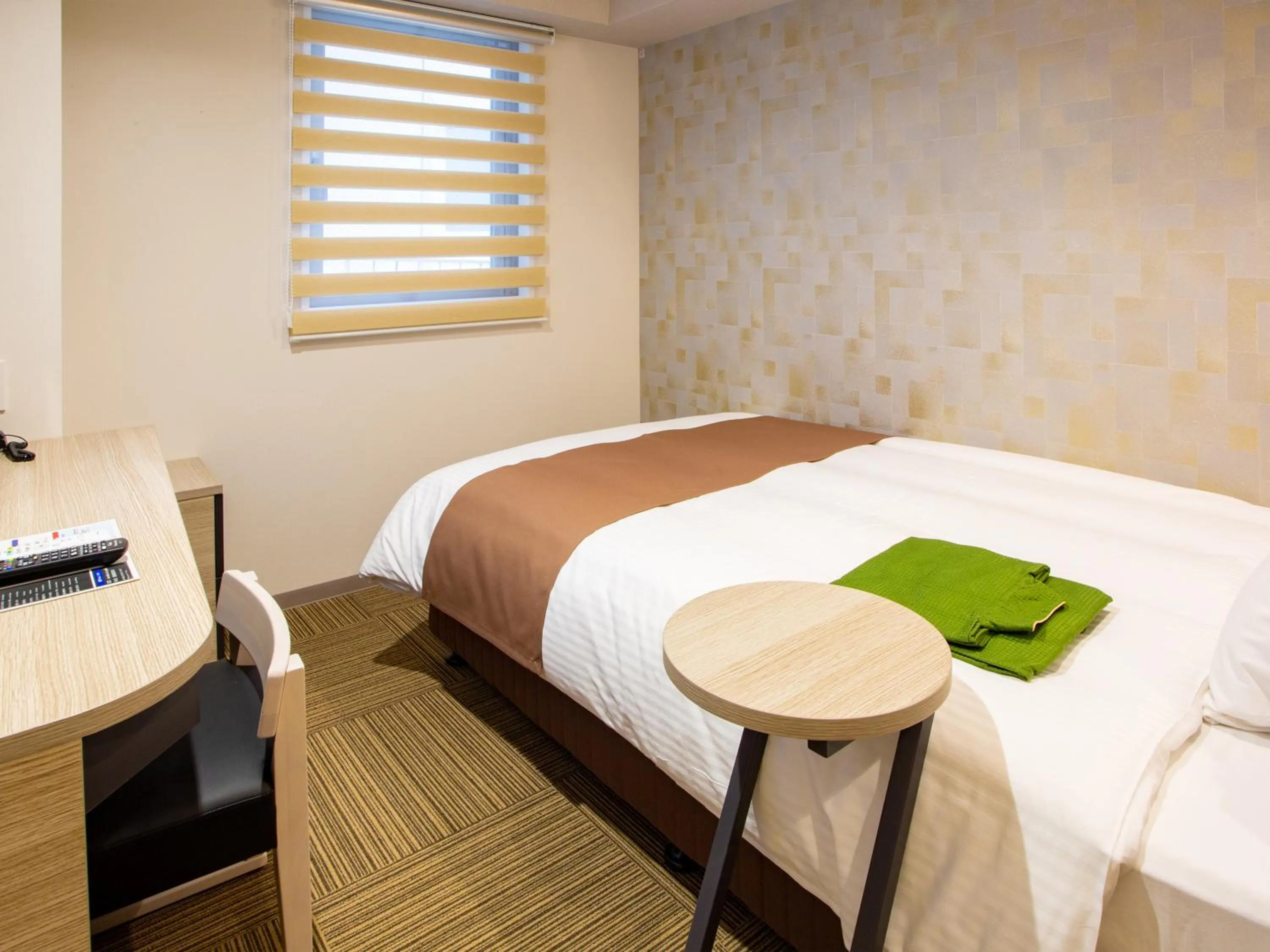 Bed in Kuretake Inn Ogaki Ekimae