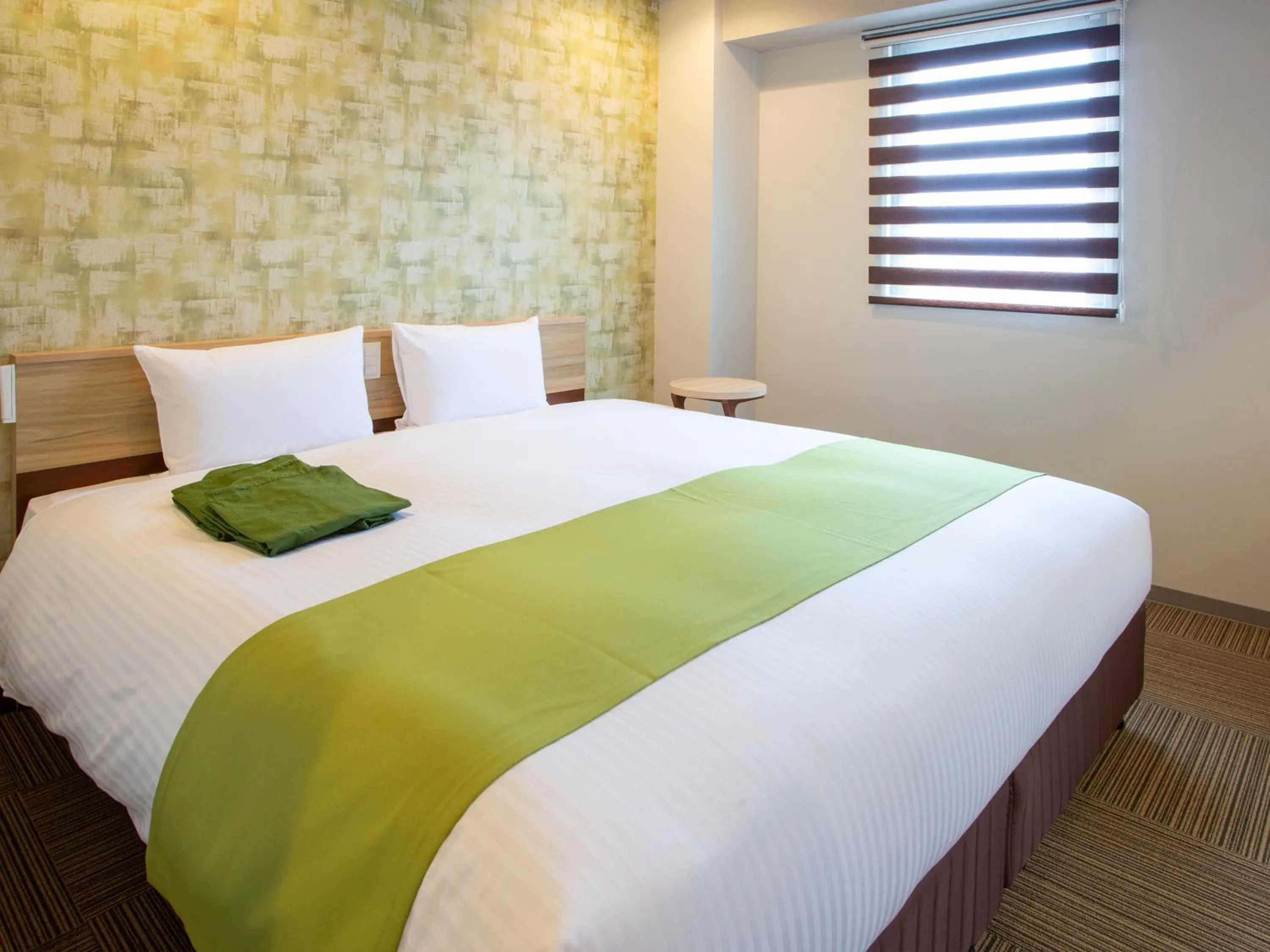 Bed in Kuretake Inn Ogaki Ekimae