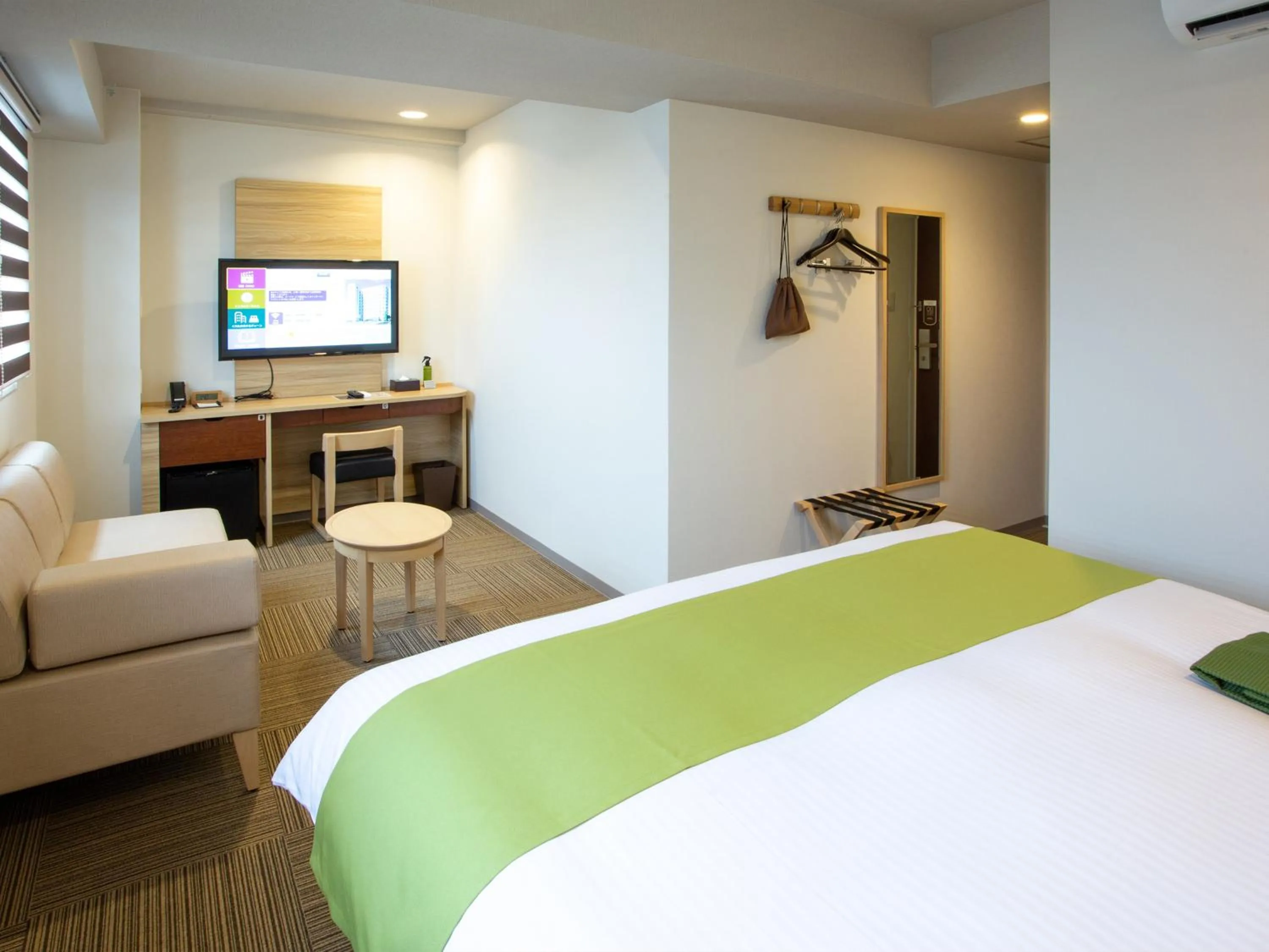 Bed in Kuretake Inn Ogaki Ekimae