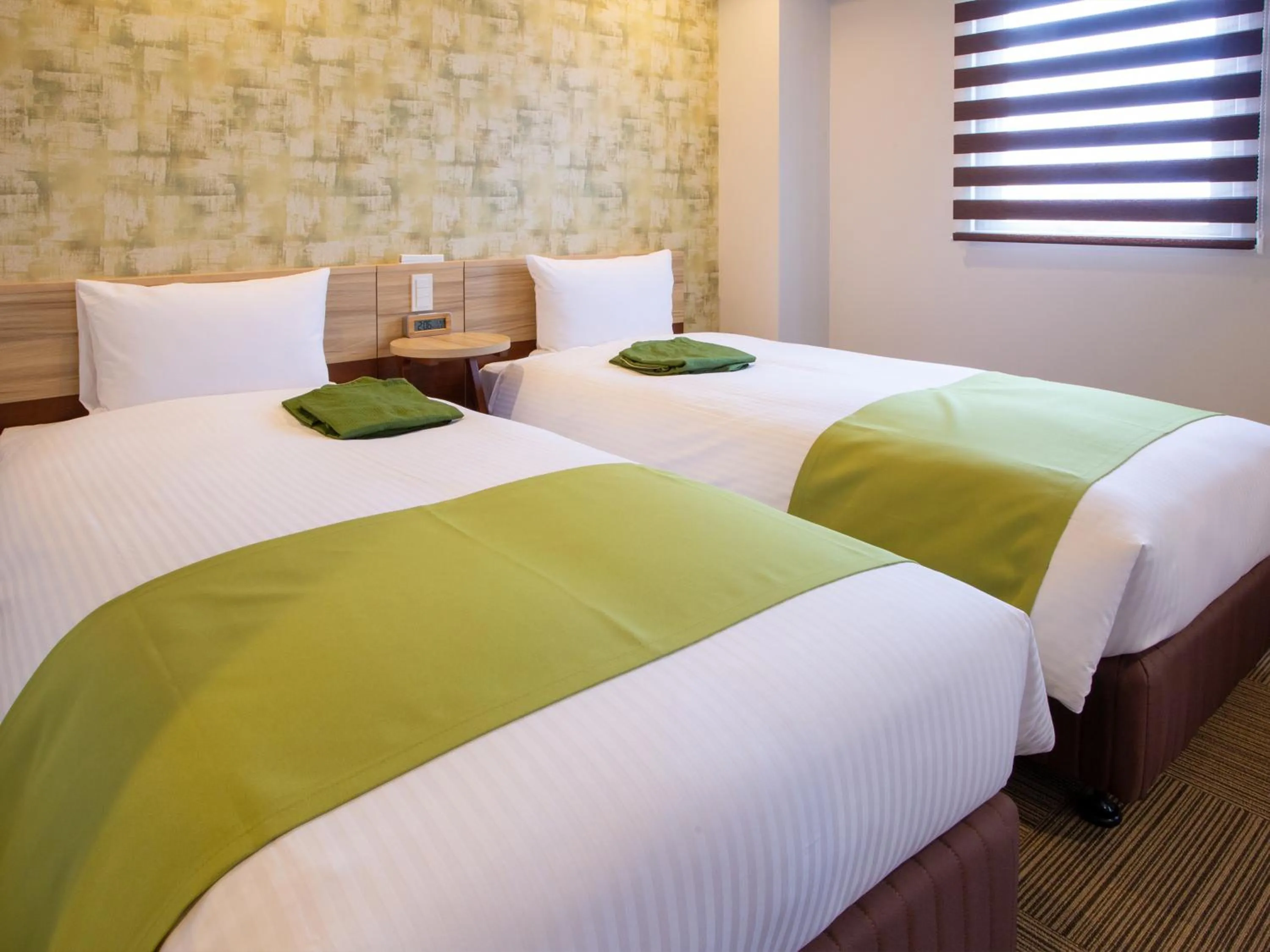 Bed in Kuretake Inn Ogaki Ekimae