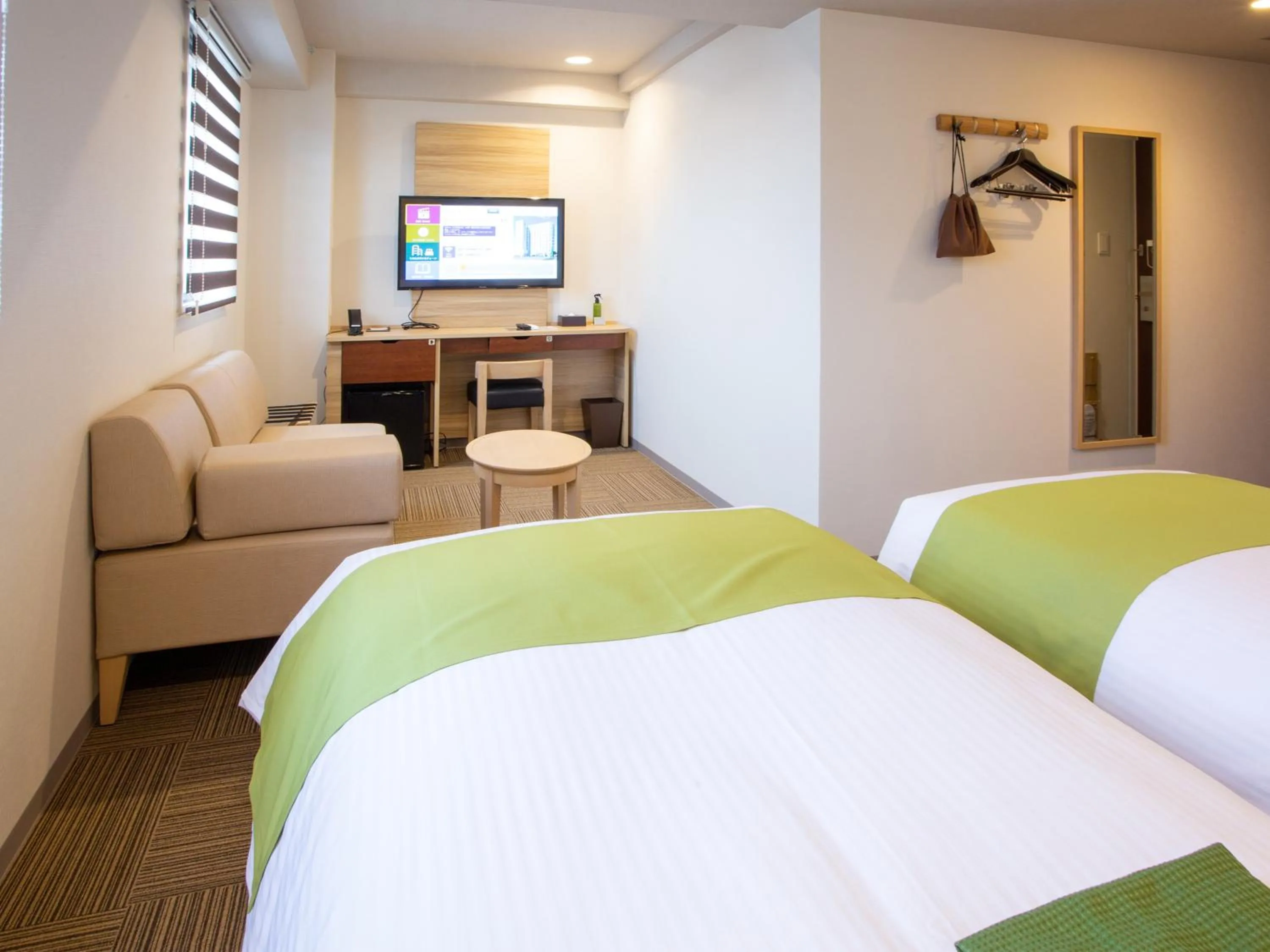 Bed in Kuretake Inn Ogaki Ekimae