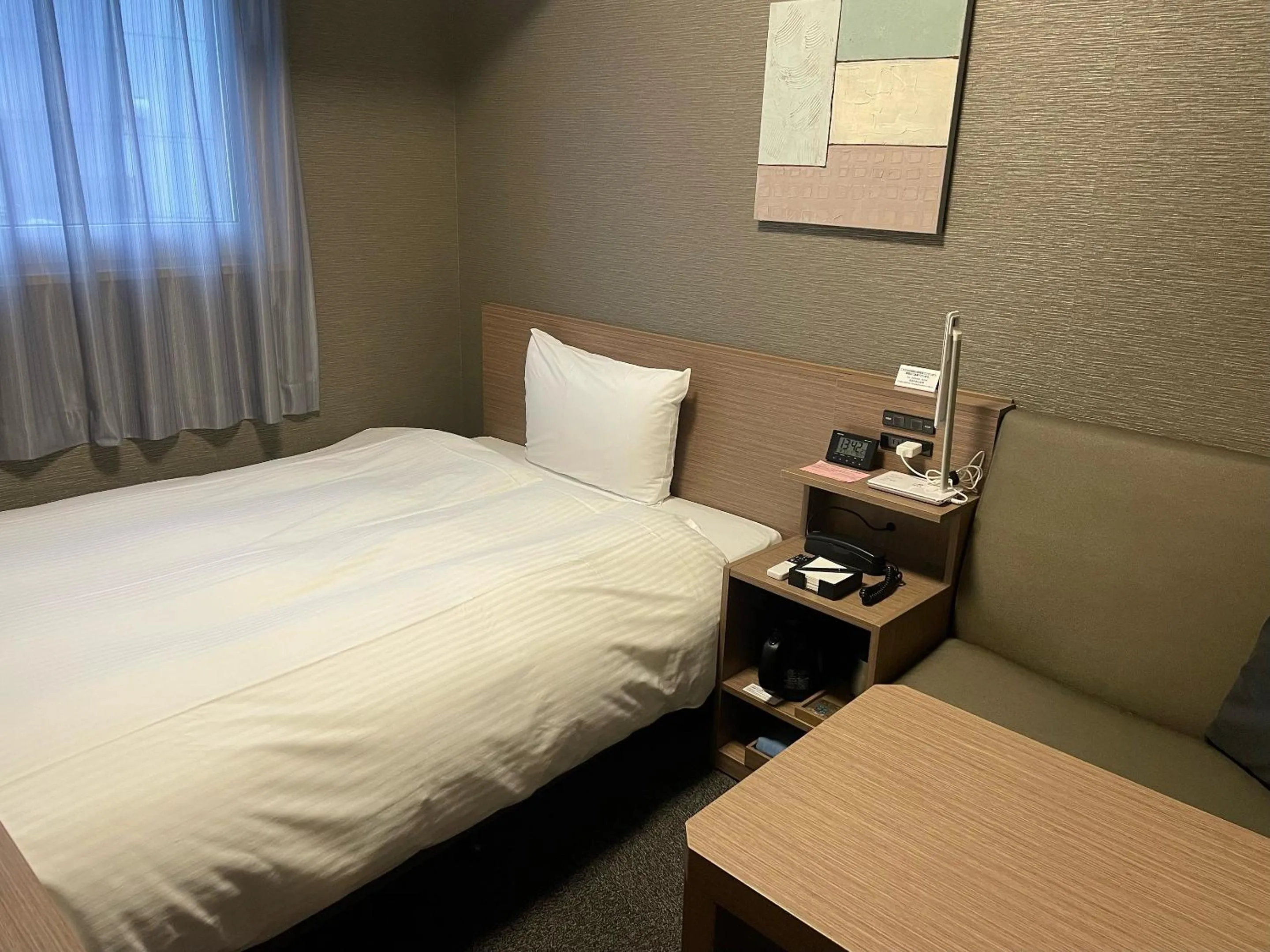 Photo of the whole room, Bed in Hotel Route-Inn Sakurai Ekimae