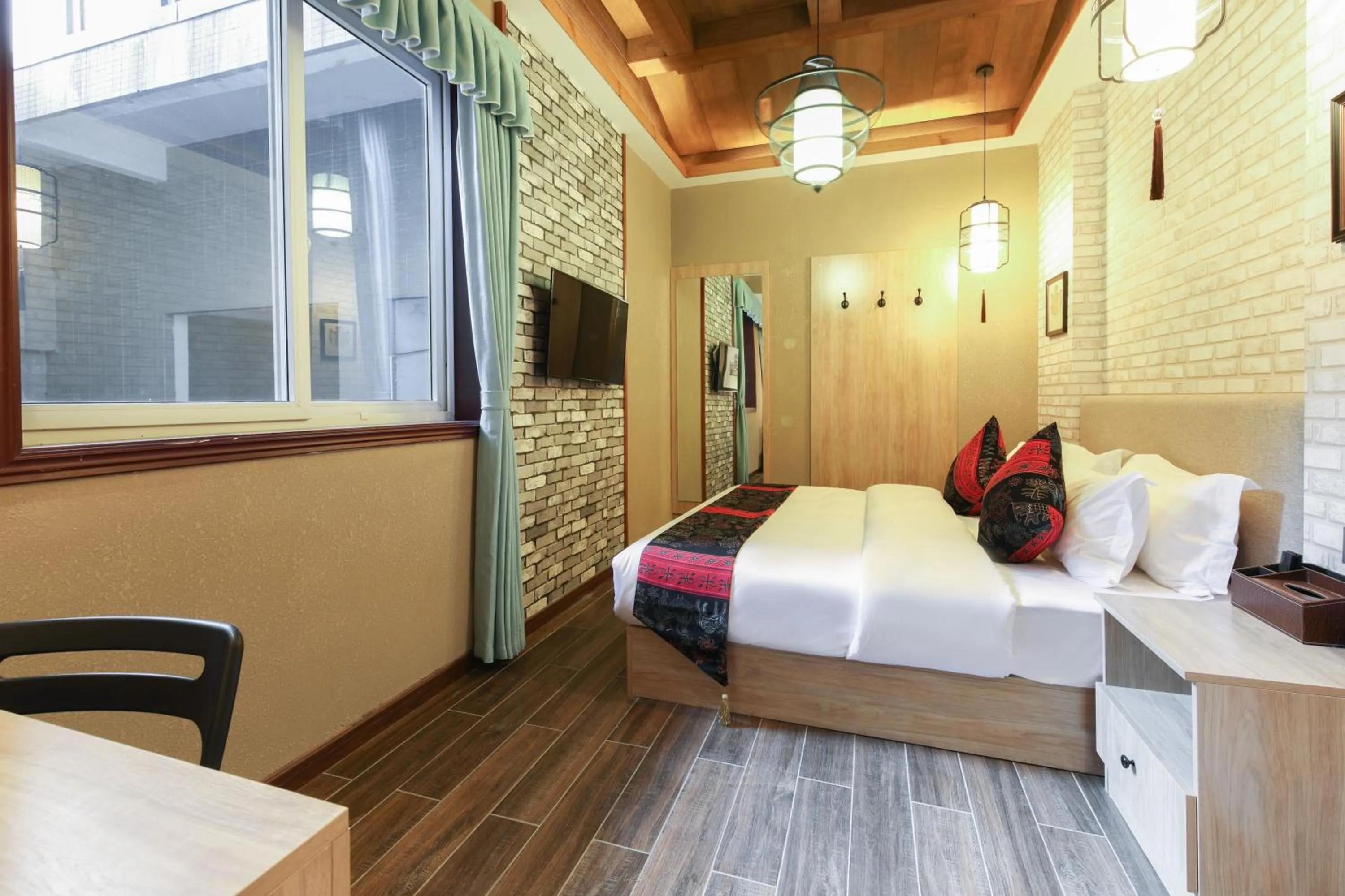 Bed in Zou Qu Ye Travel Hotel