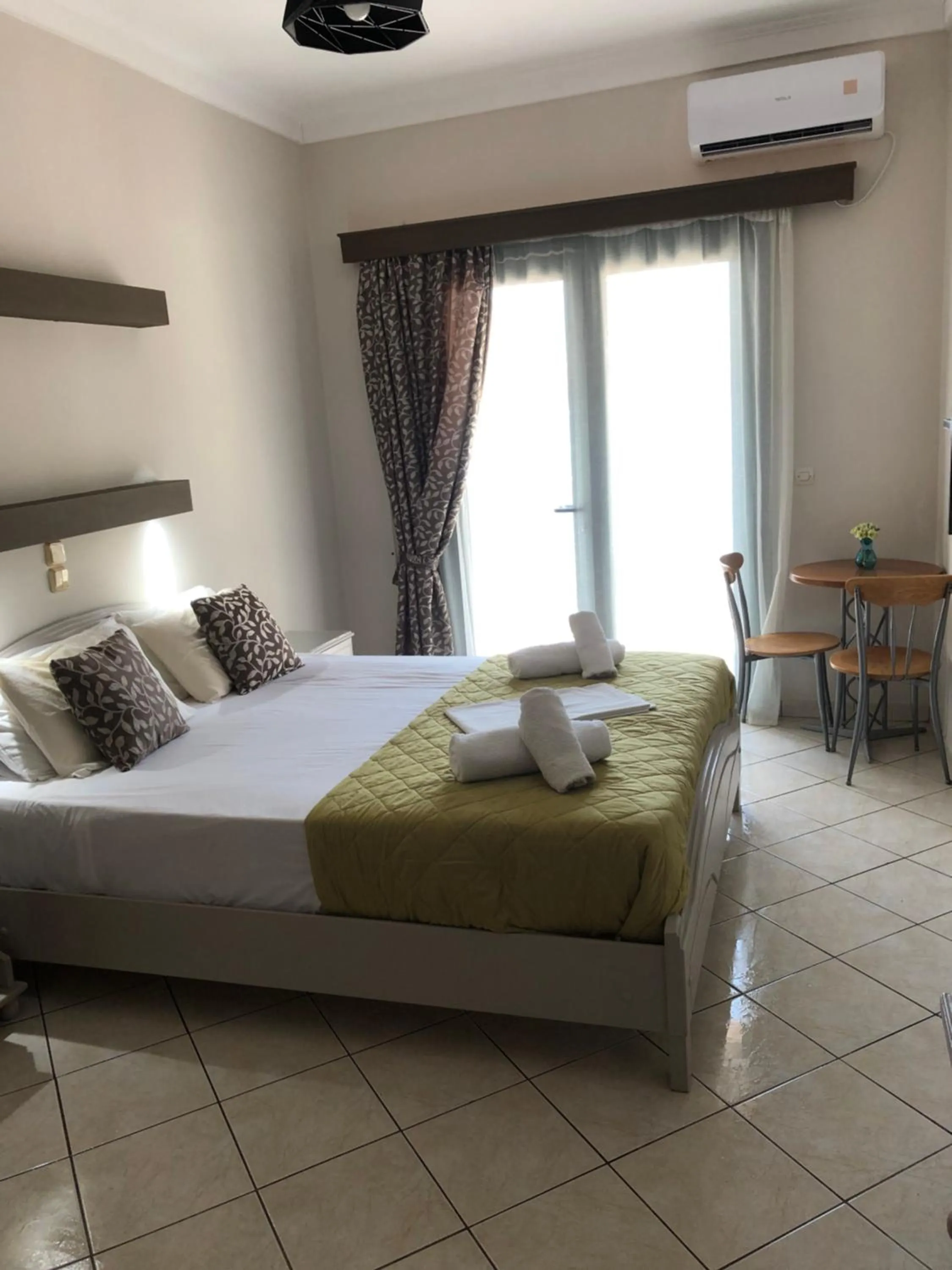 Bed in Poseidon Apartments