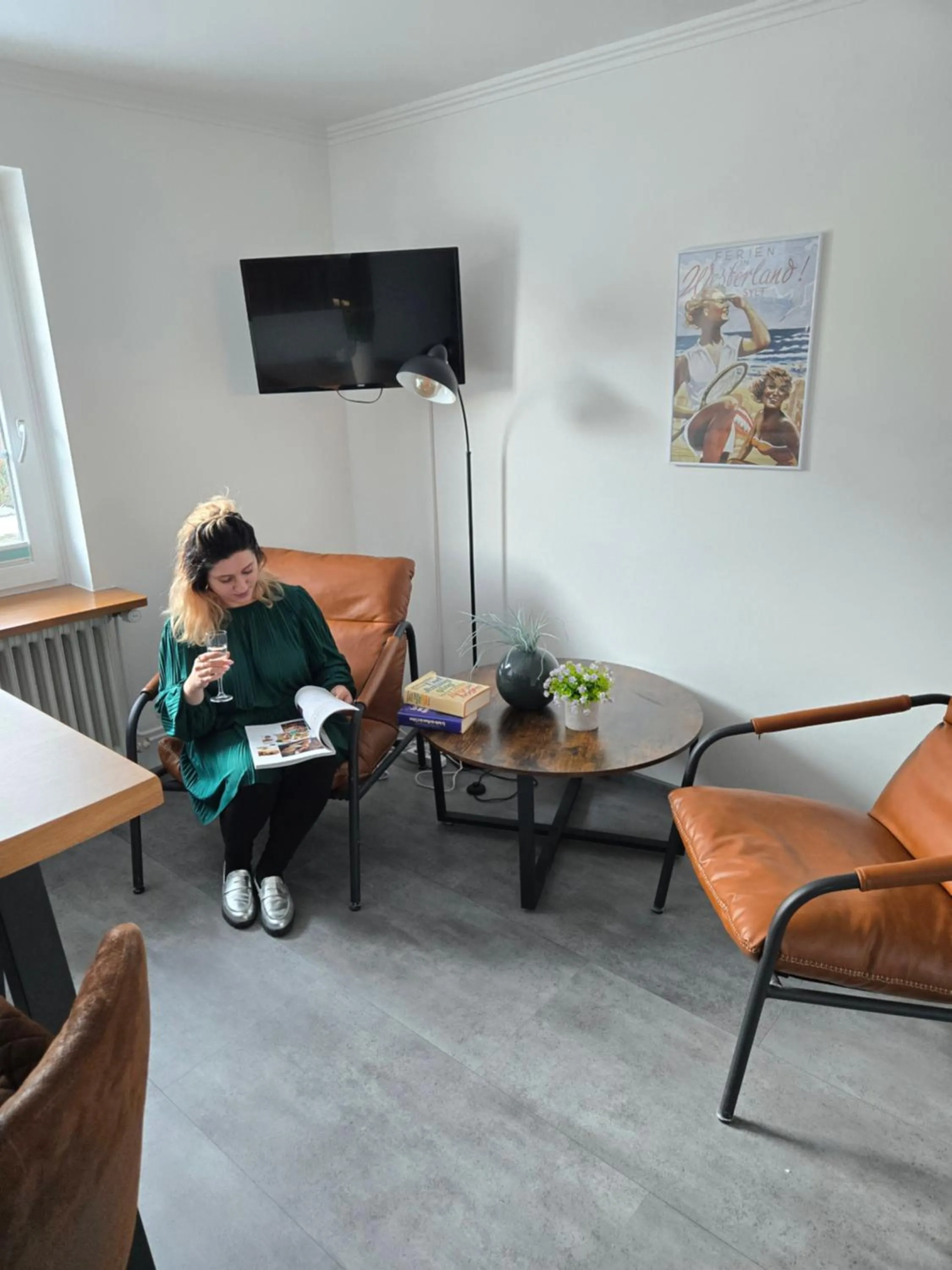 Communal lounge/ TV room in Villa am Meer