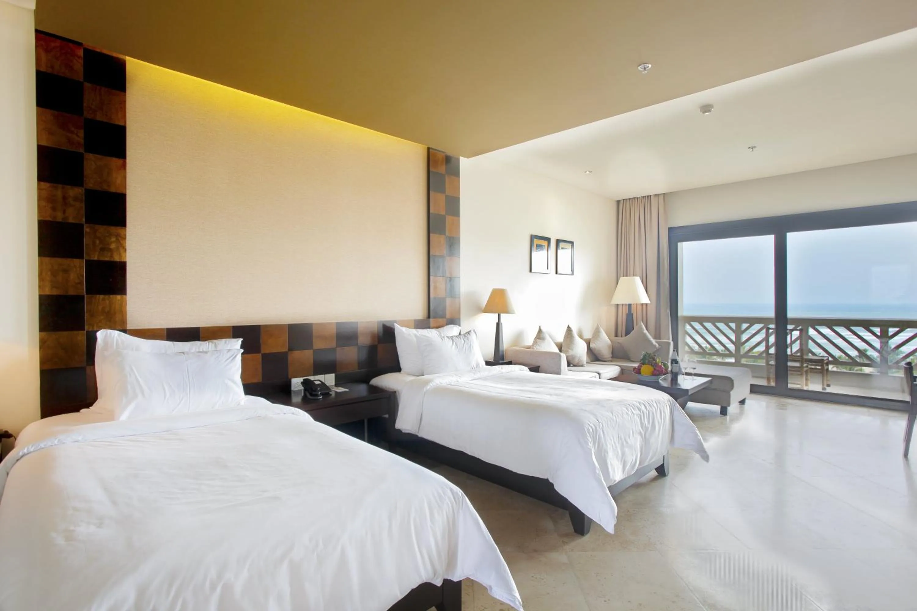 Bed in Olalani Resort & Condotel