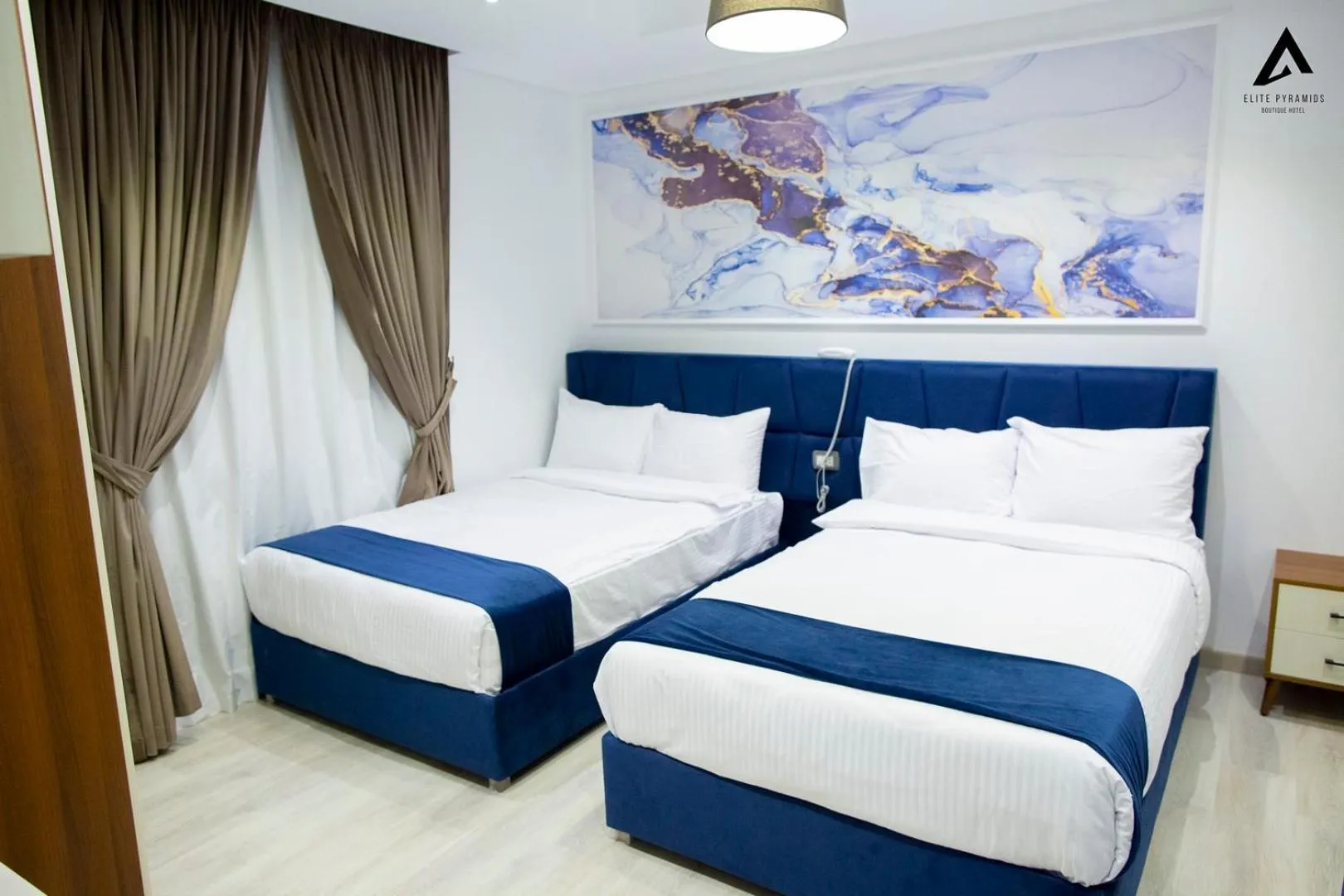 Bed in Elite Pyramids Boutique Hotel