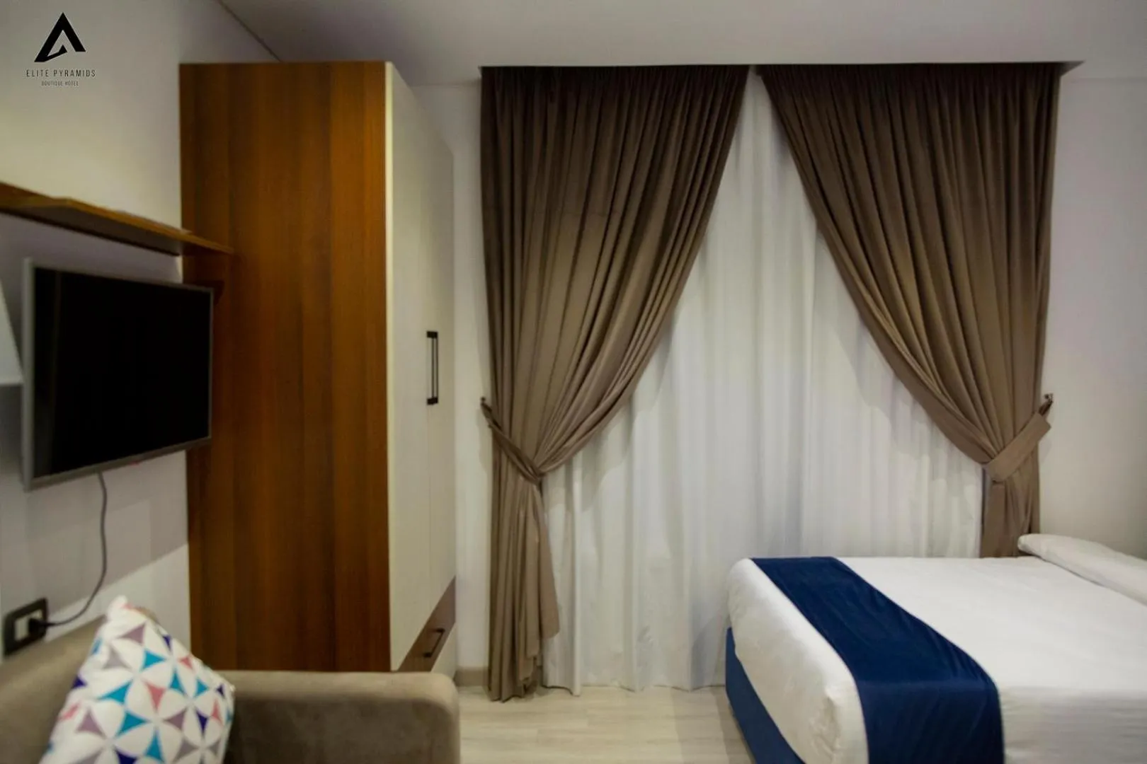 Bed in Elite Pyramids Boutique Hotel