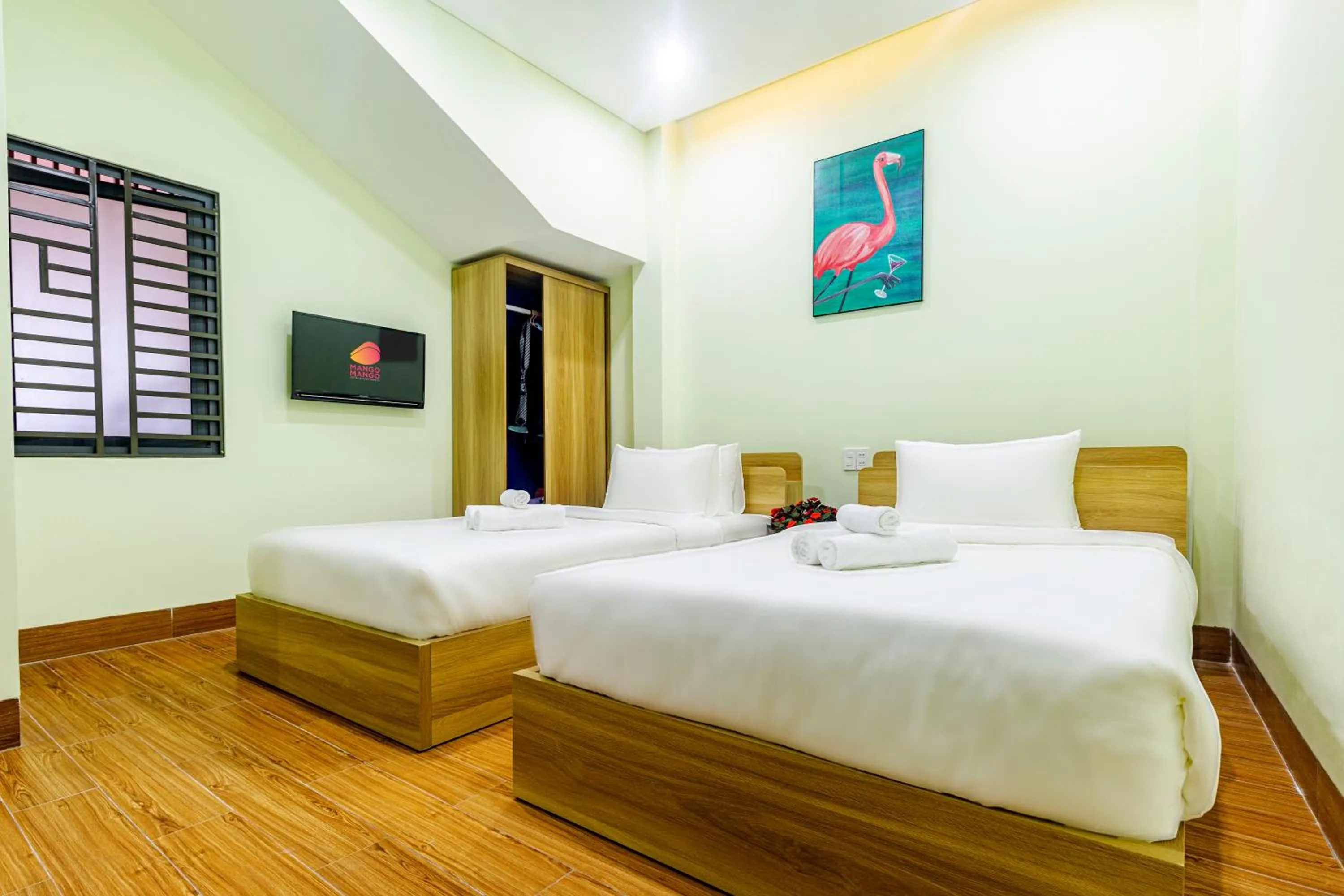 Bed in MANGO MANGO HOTEL & APARTMENT