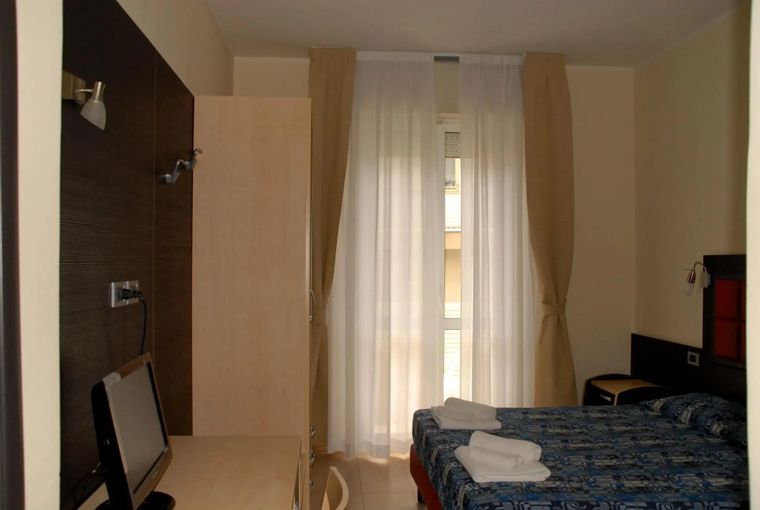 Bed in Hotel Arno Rimini