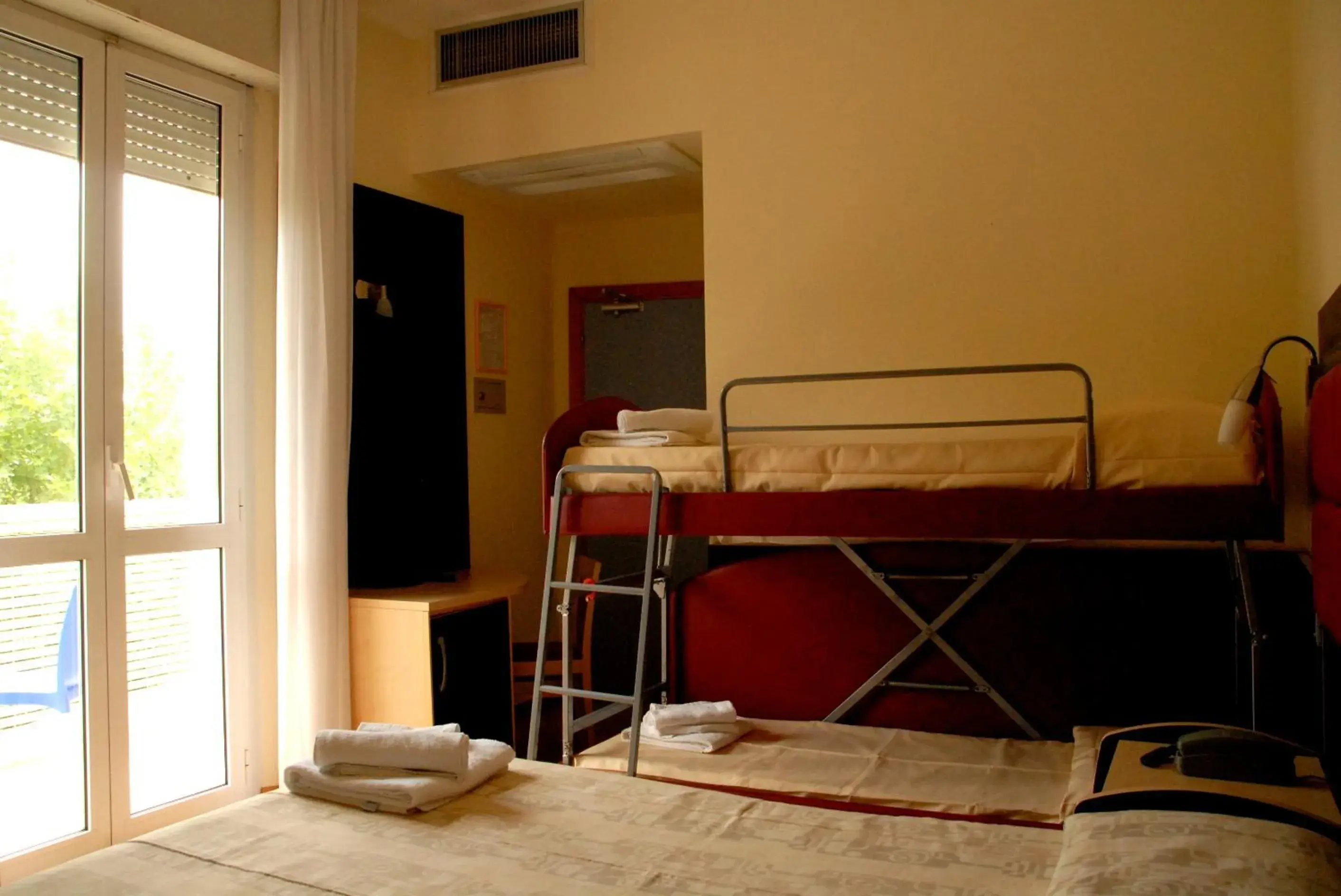 Bed in Hotel Arno Rimini