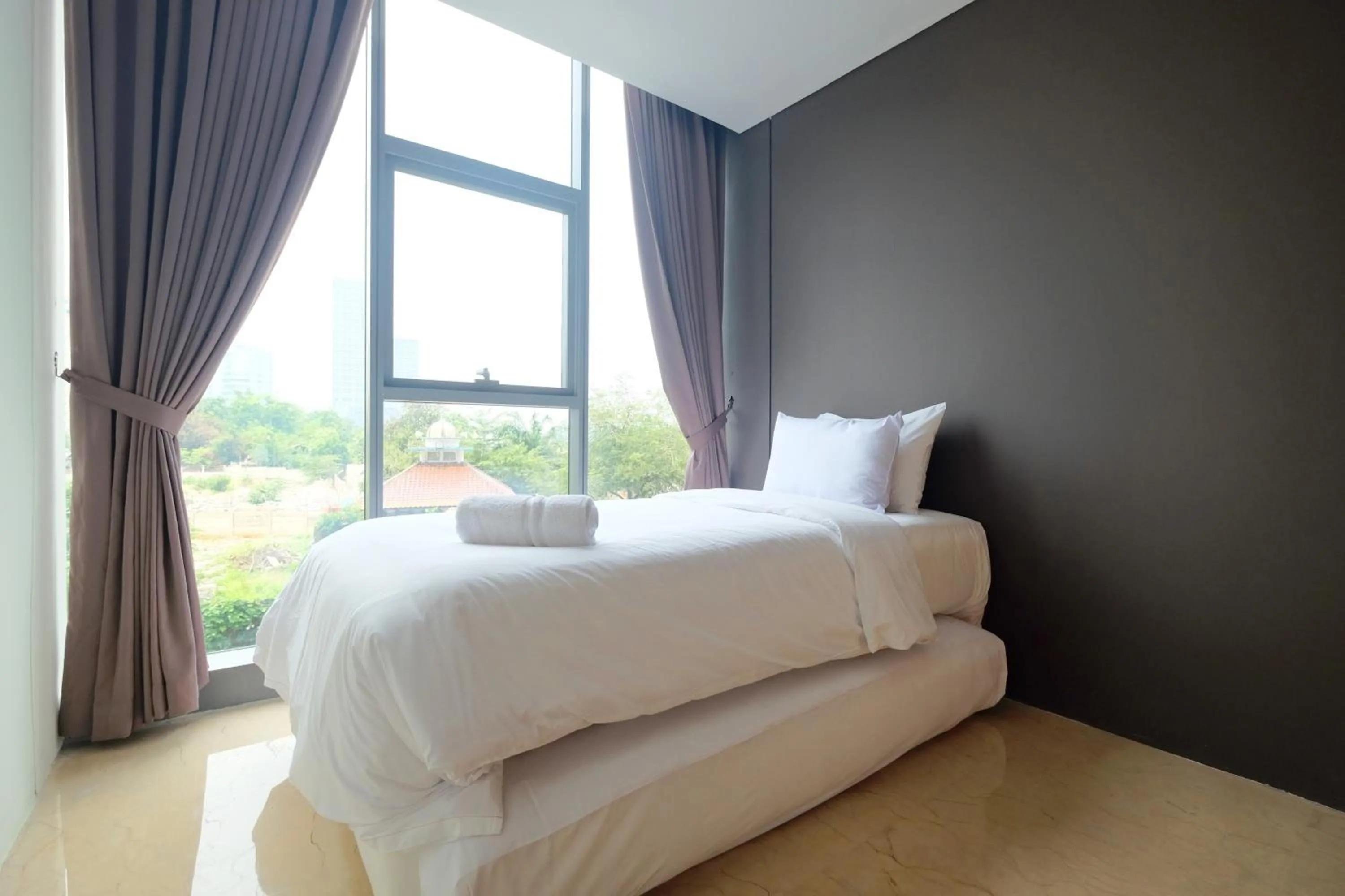 Bed in 2BR Pancoran L'Avenue Apartment Great Facility By Travelio